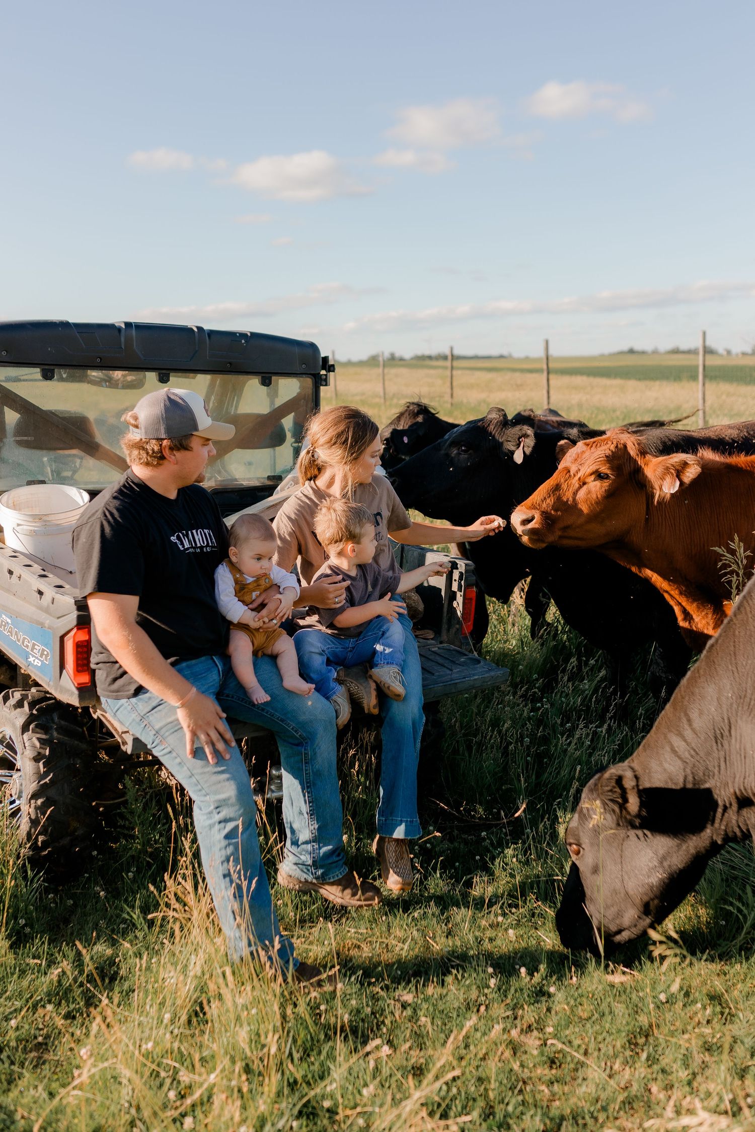 Family portrait on a working farm during lifestyle photo session in Clark County, South Dakota