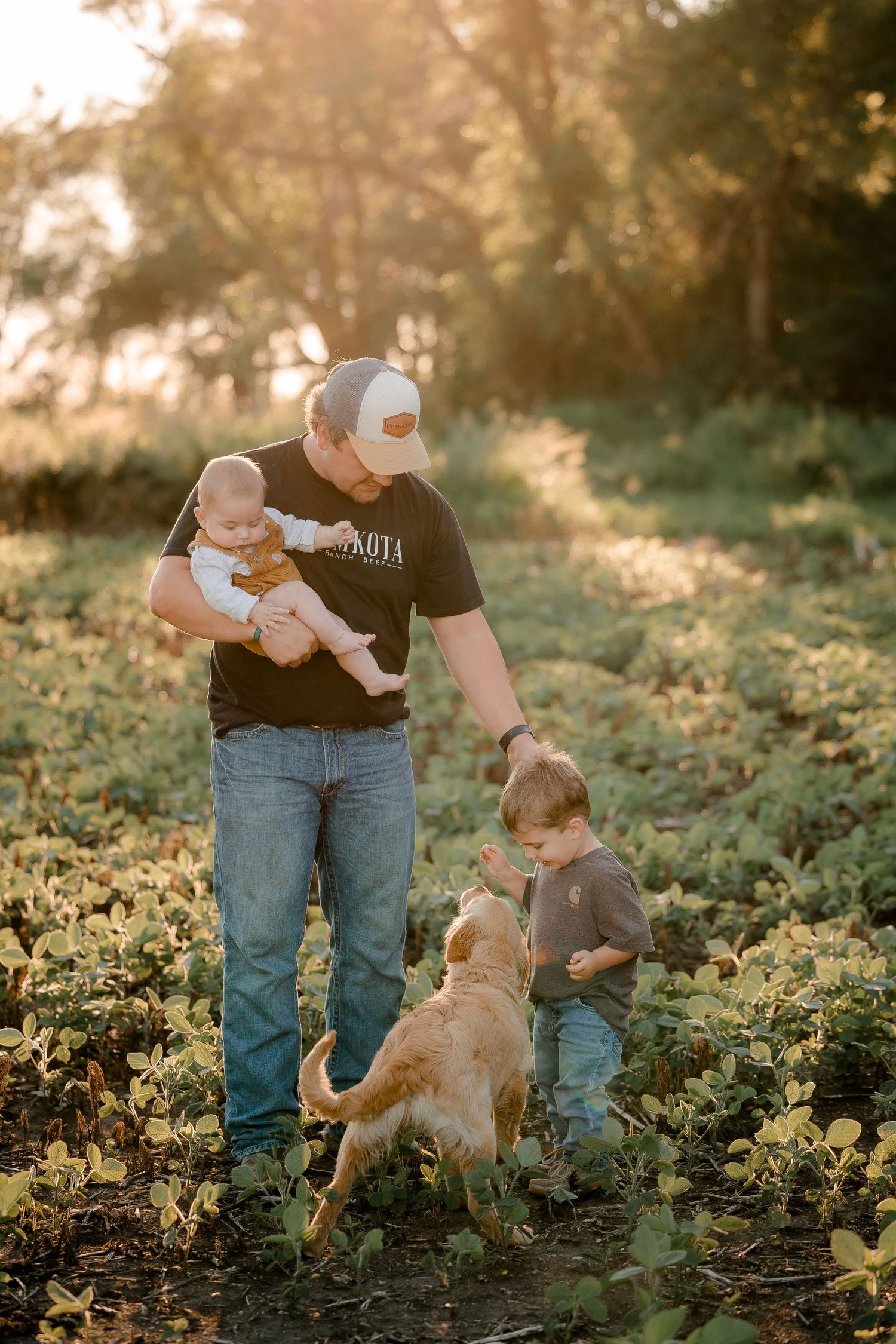 Family portrait on a working farm during lifestyle photo session in Clark County, South Dakota