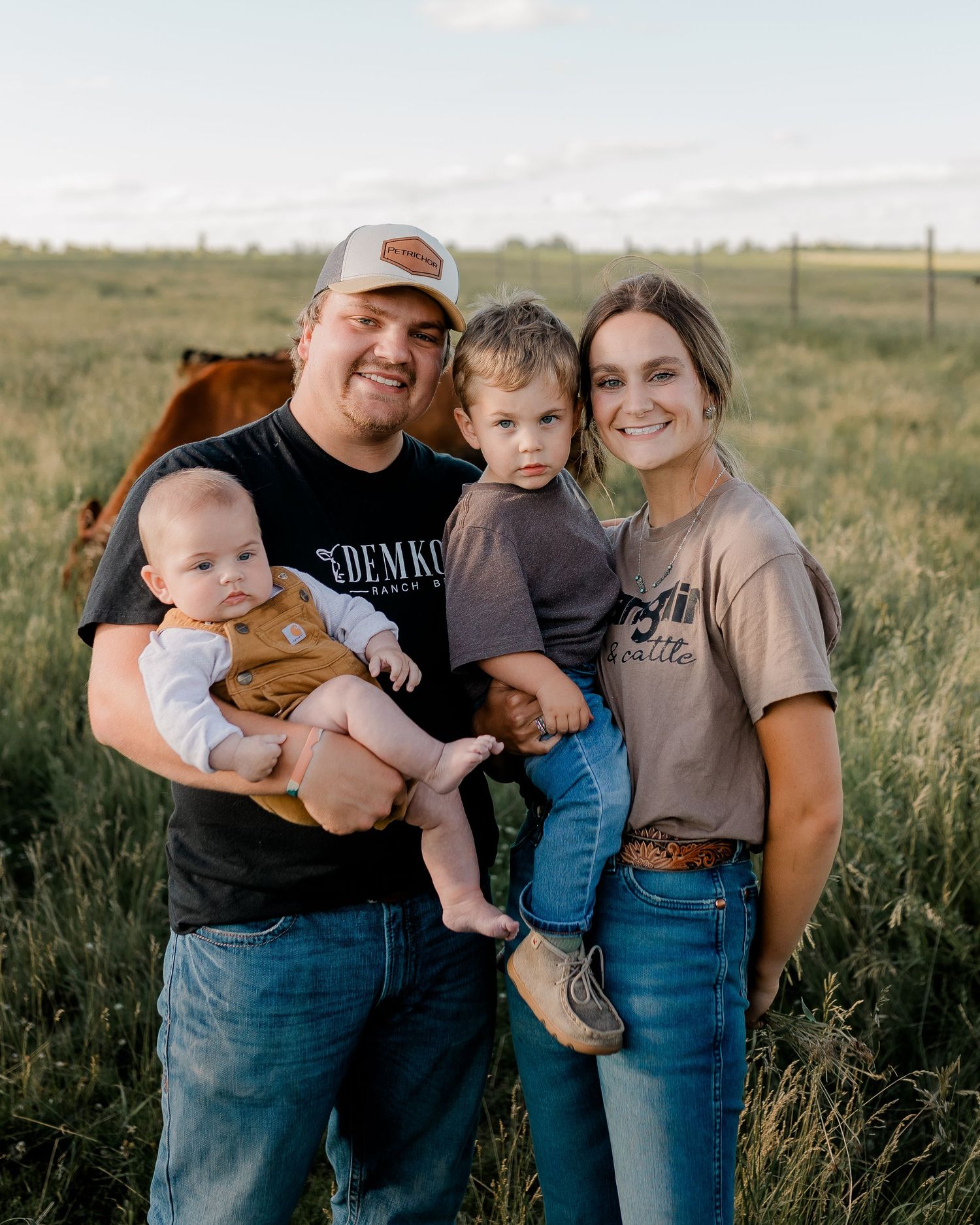 Family portrait on a working farm during lifestyle photo session in Clark County, South Dakota