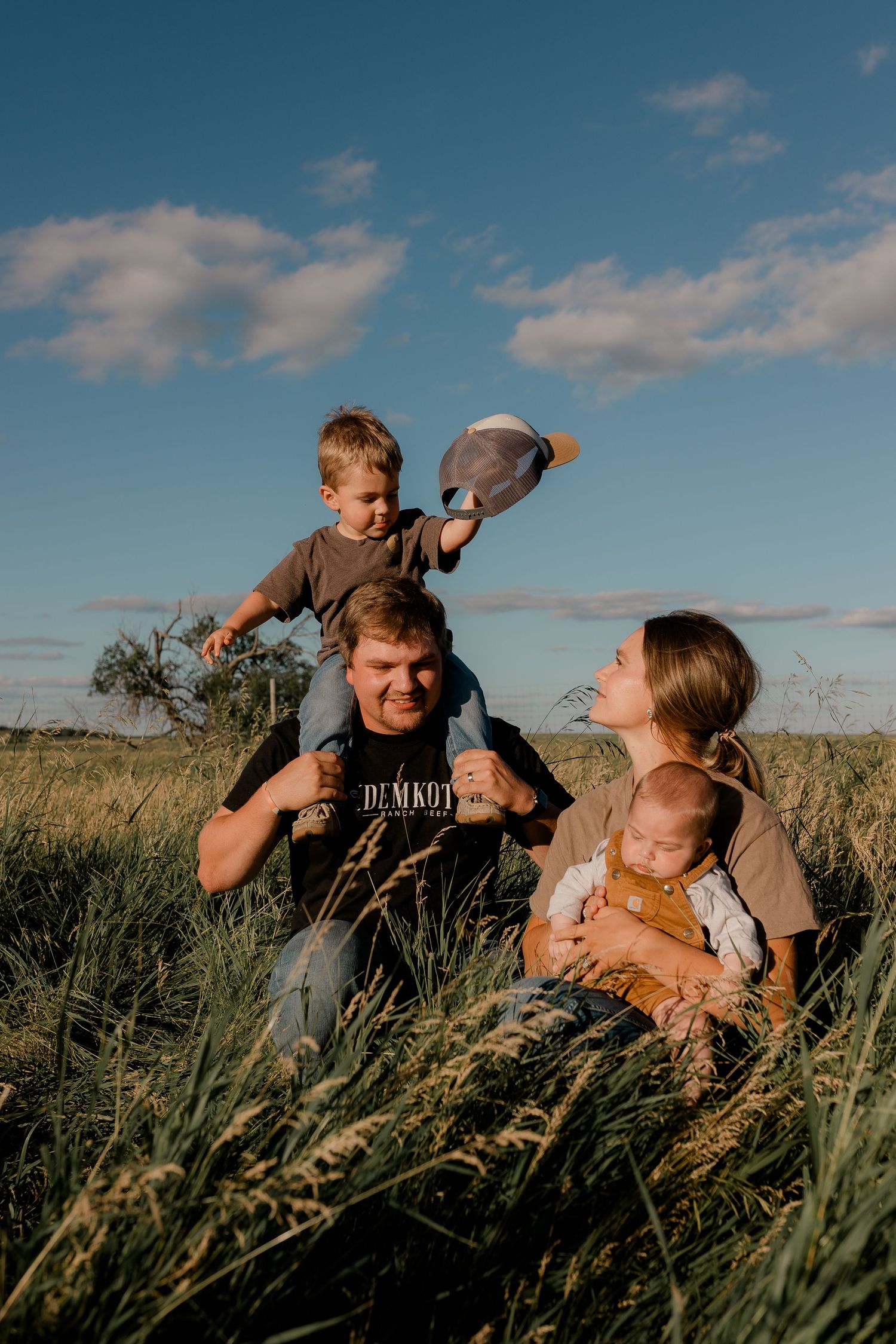 Family portrait on a working farm during lifestyle photo session in Clark County, South Dakota