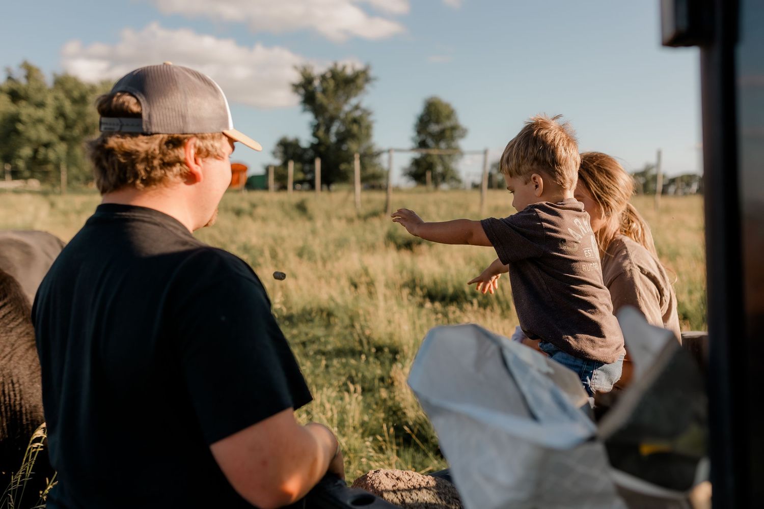 Family portrait on a working farm during lifestyle photo session in Clark County, South Dakota