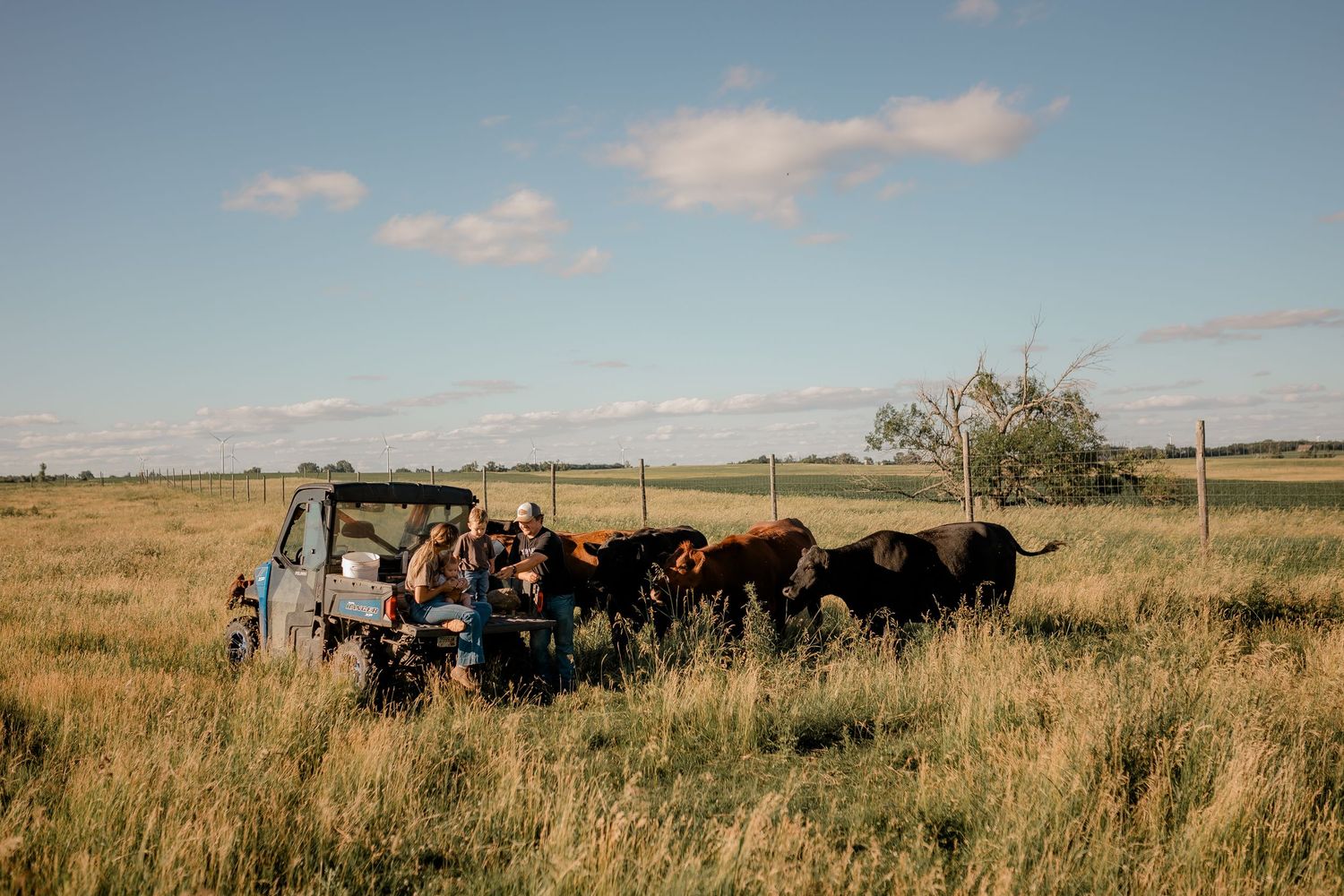 Family portrait on a working farm during lifestyle photo session in Clark County, South Dakota