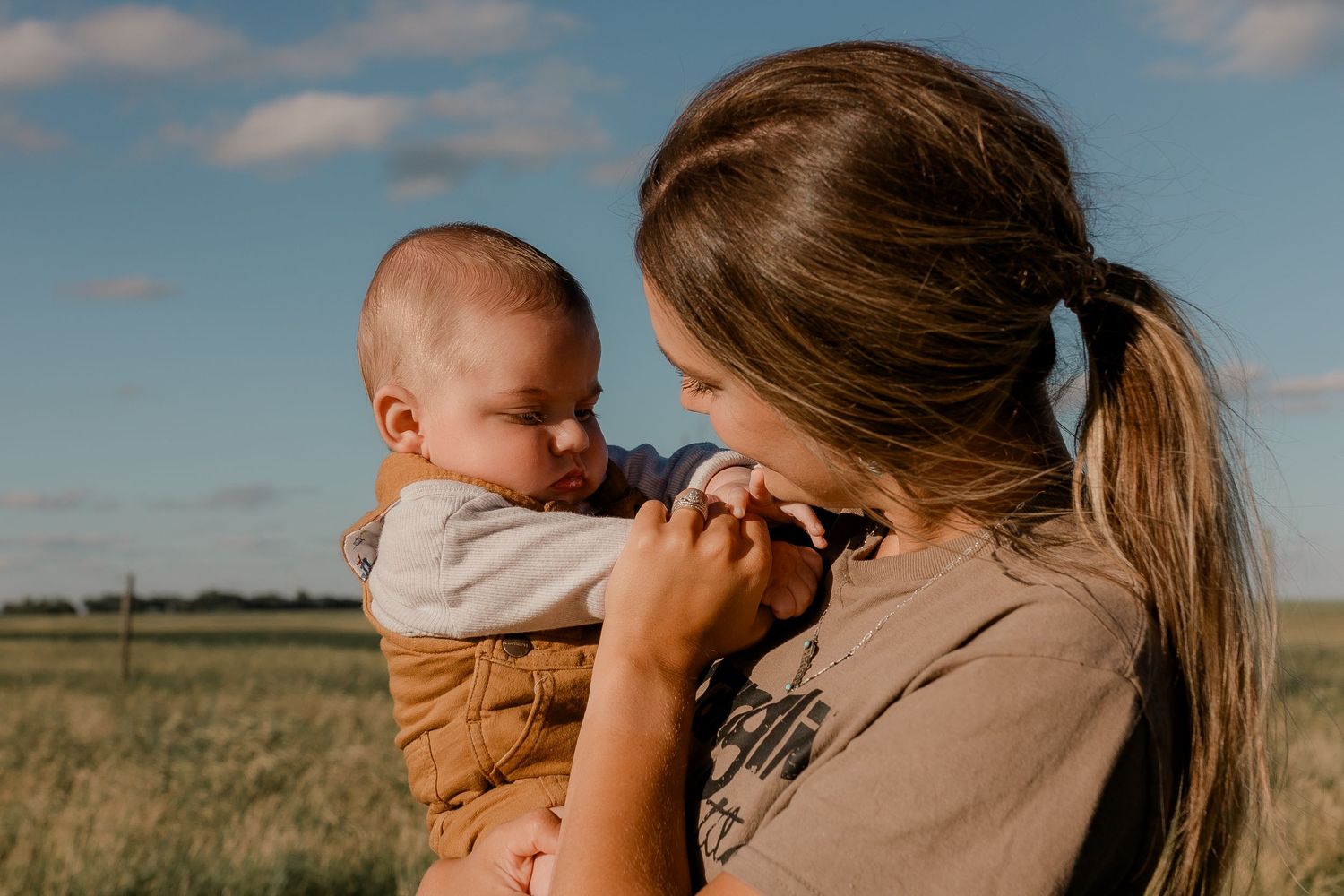 Family portrait on a working farm during lifestyle photo session in Clark County, South Dakota