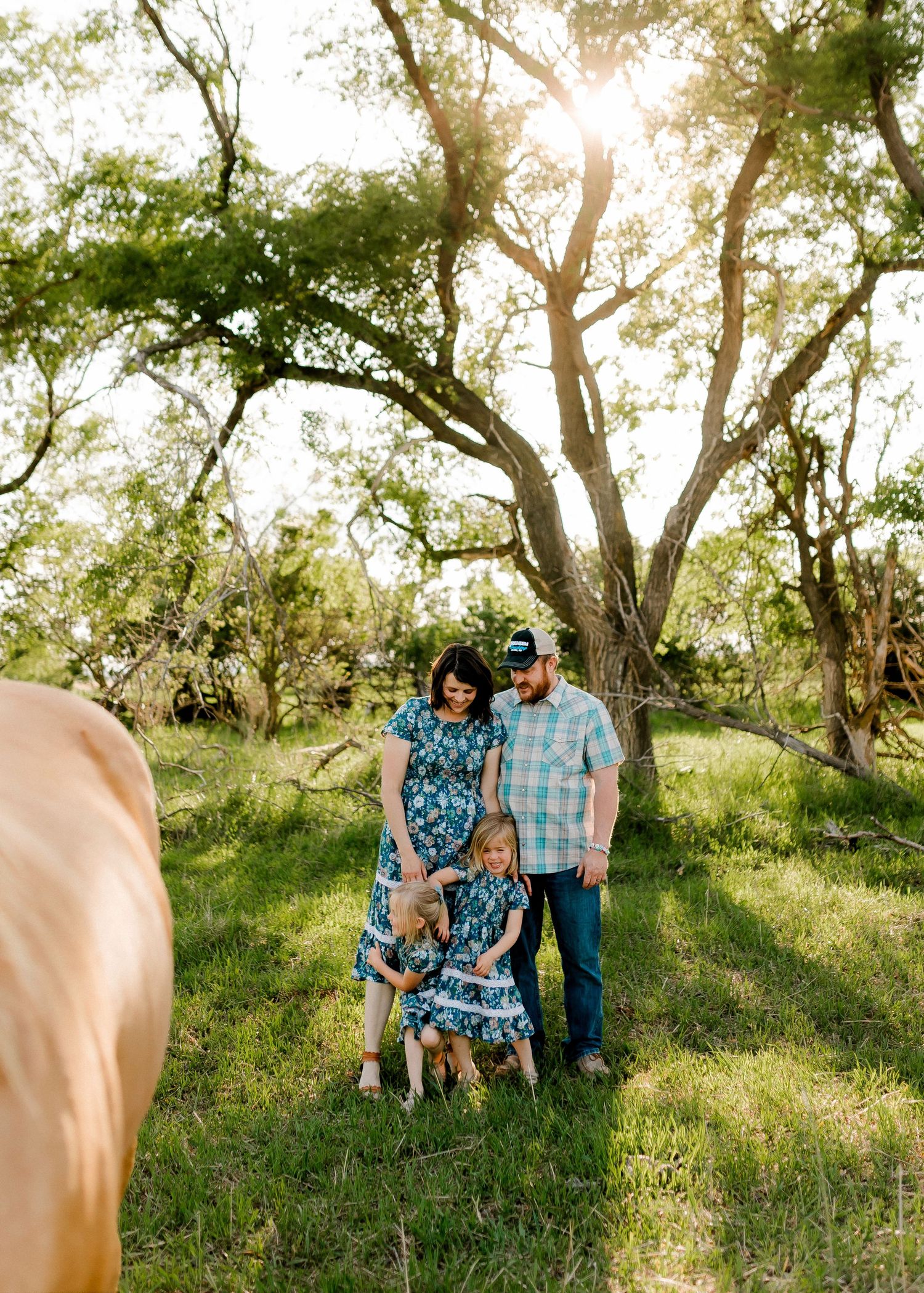 Candid family portrait with natural light and movement