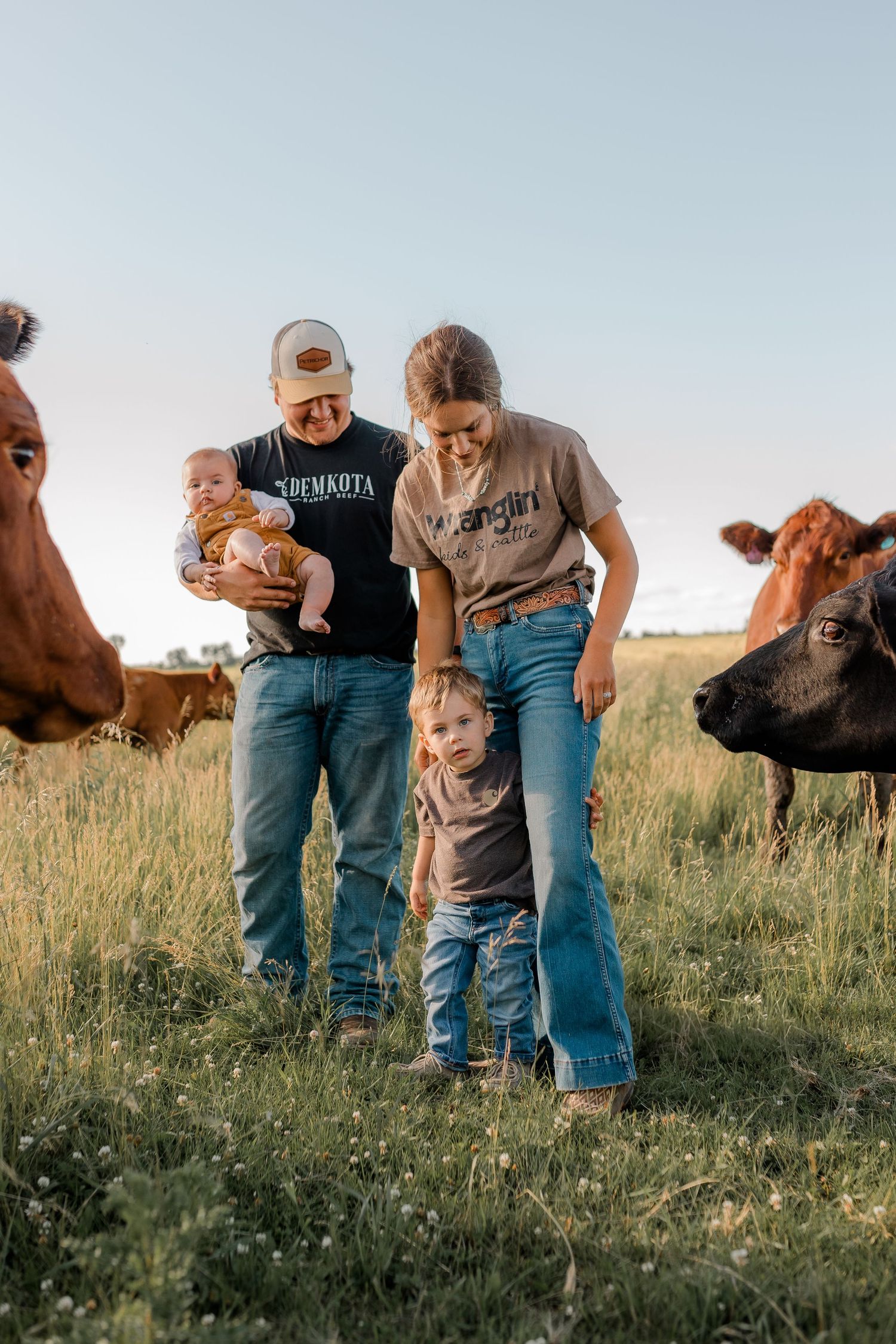 Family portrait on a working farm during lifestyle photo session in Clark County, South Dakota