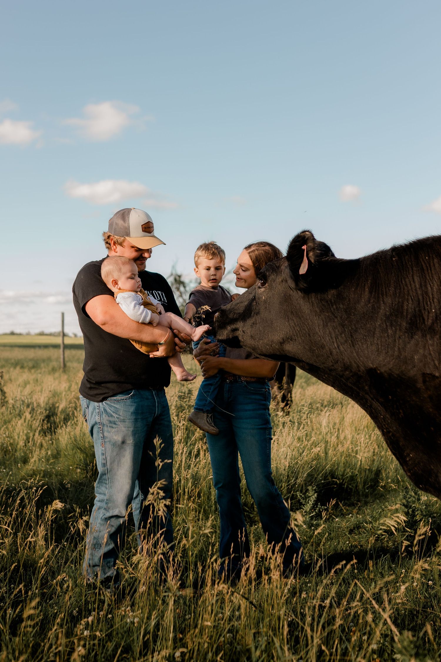 Family portrait on a working farm during lifestyle photo session in Clark County, South Dakota