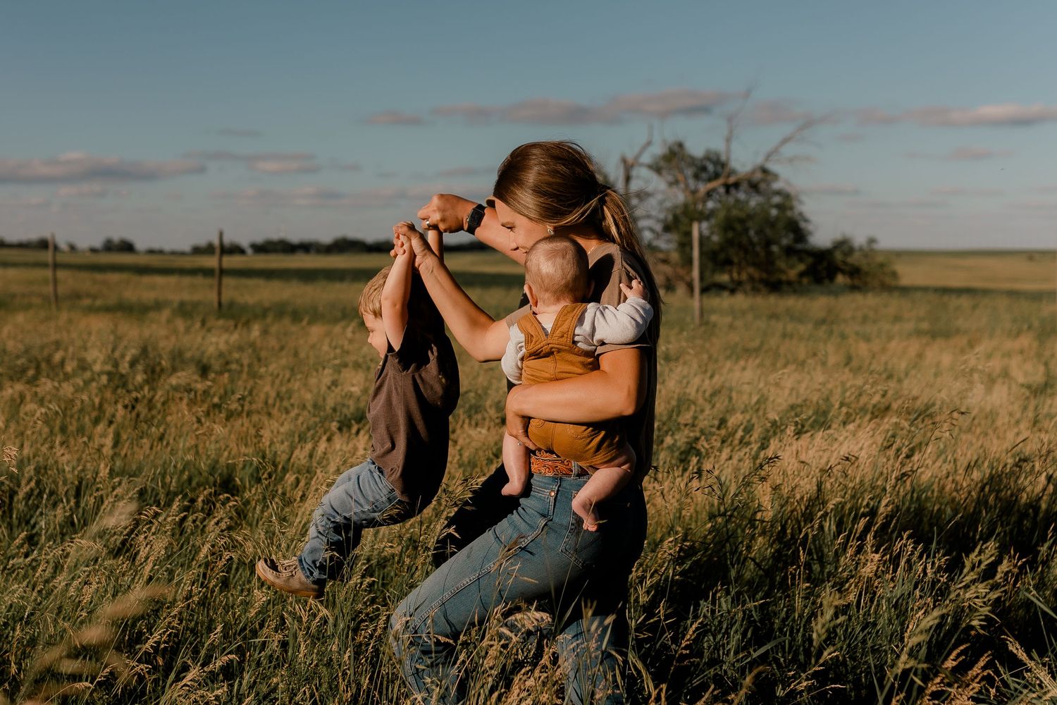Family portrait on a working farm during lifestyle photo session in Clark County, South Dakota