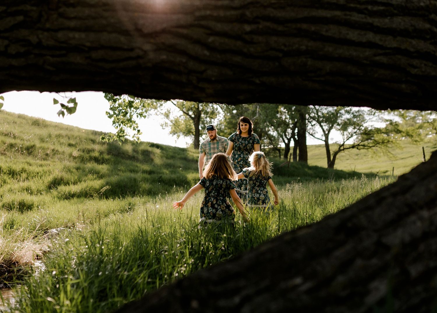 Candid family portrait with natural light and movement