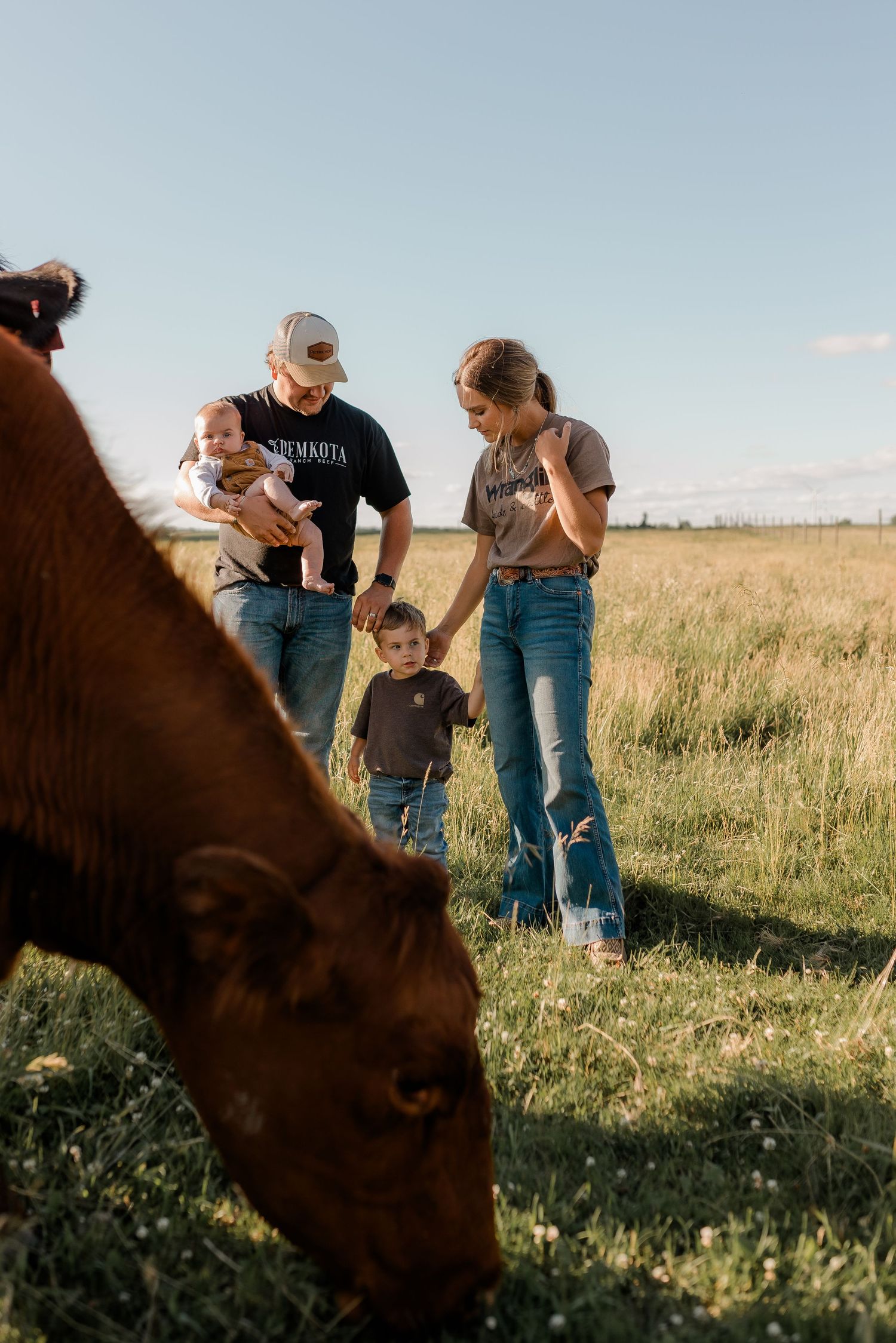 Family portrait on a working farm during lifestyle photo session in Clark County, South Dakota