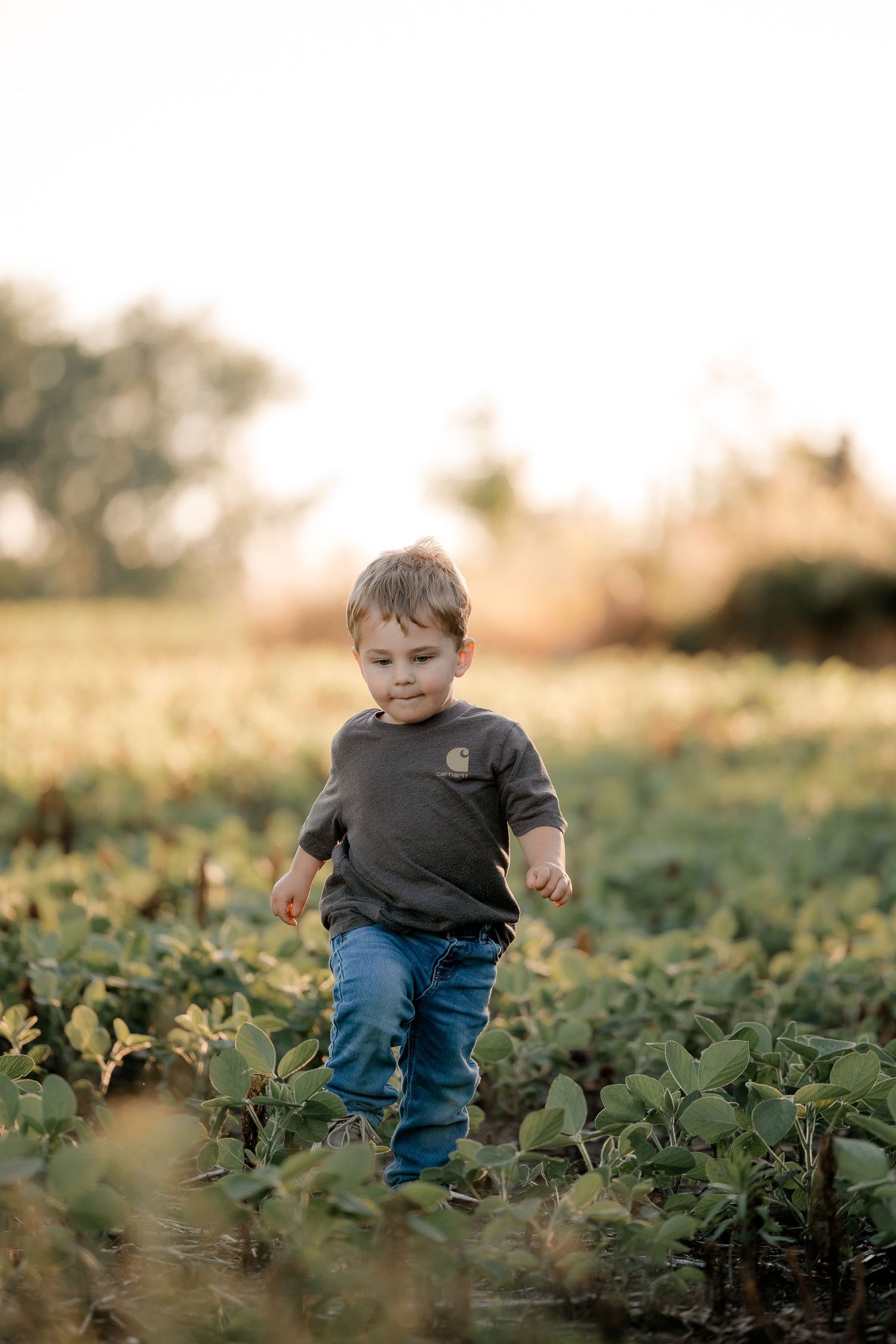 Family portrait on a working farm during lifestyle photo session in Clark County, South Dakota
