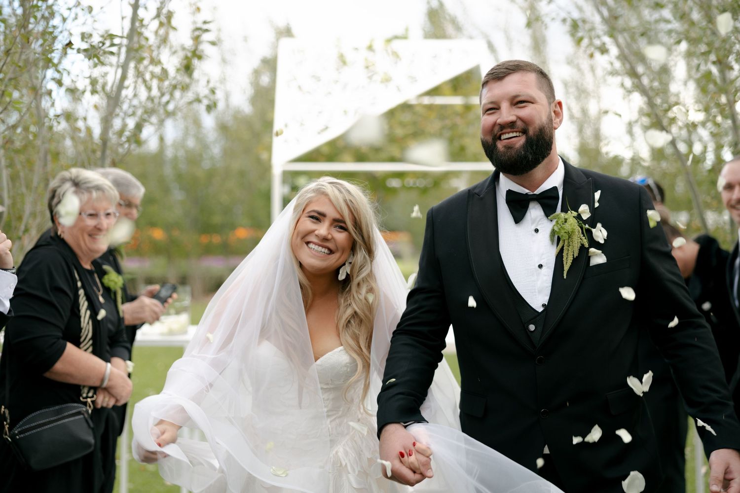 bride and groom during a confetti shower