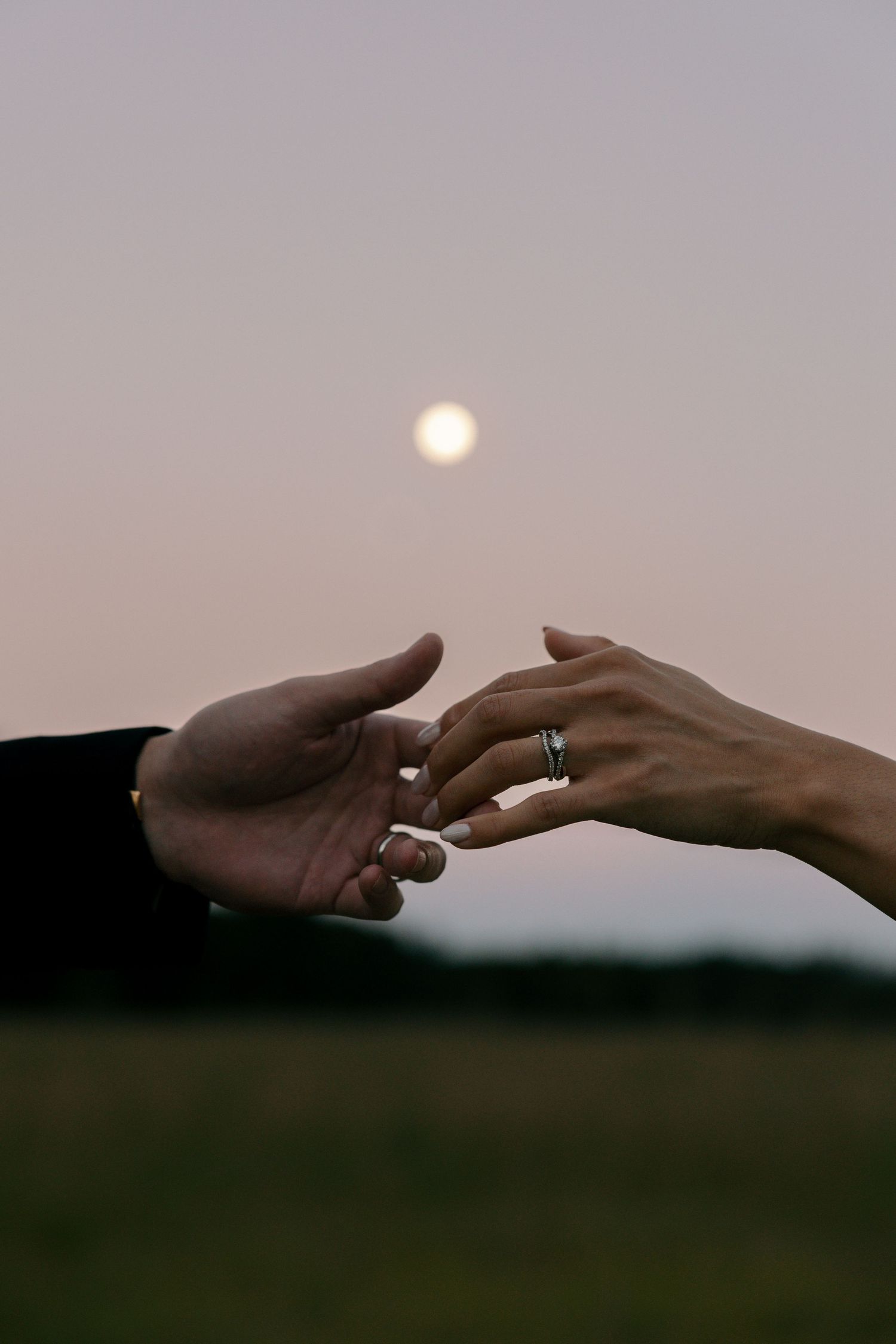 bride and groom hand touching