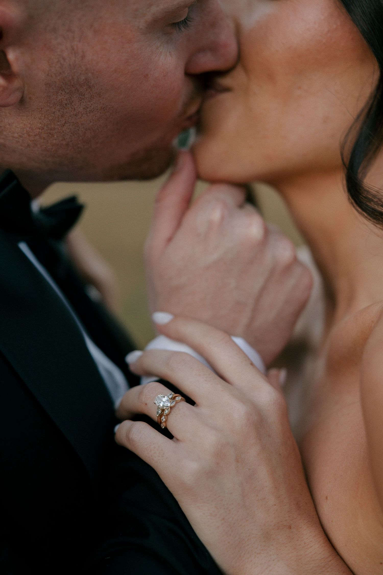 close up of bride and groom kissing
