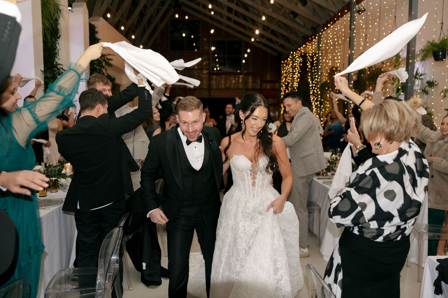 bride and groom entering their reception