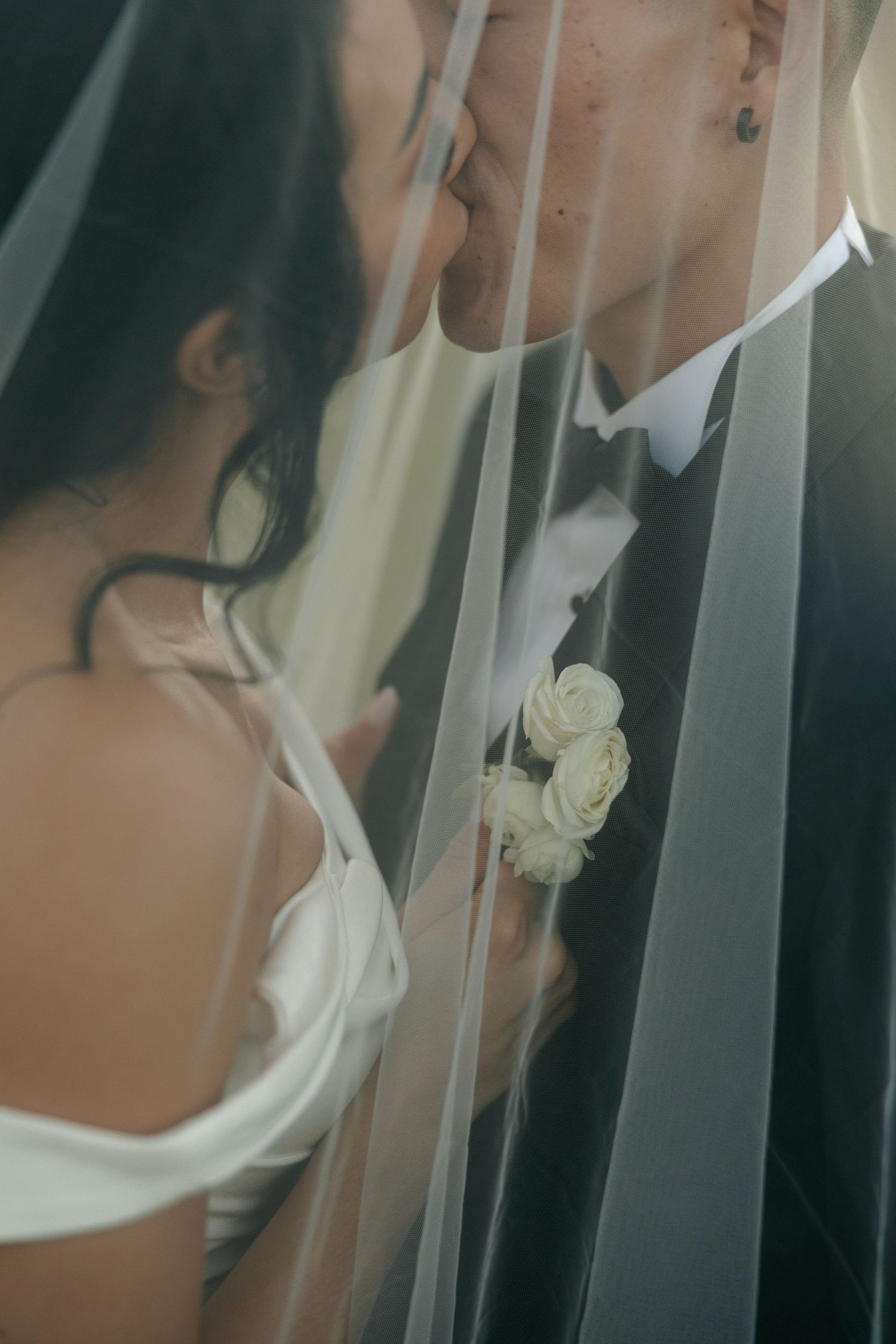 bride and groom under the veil