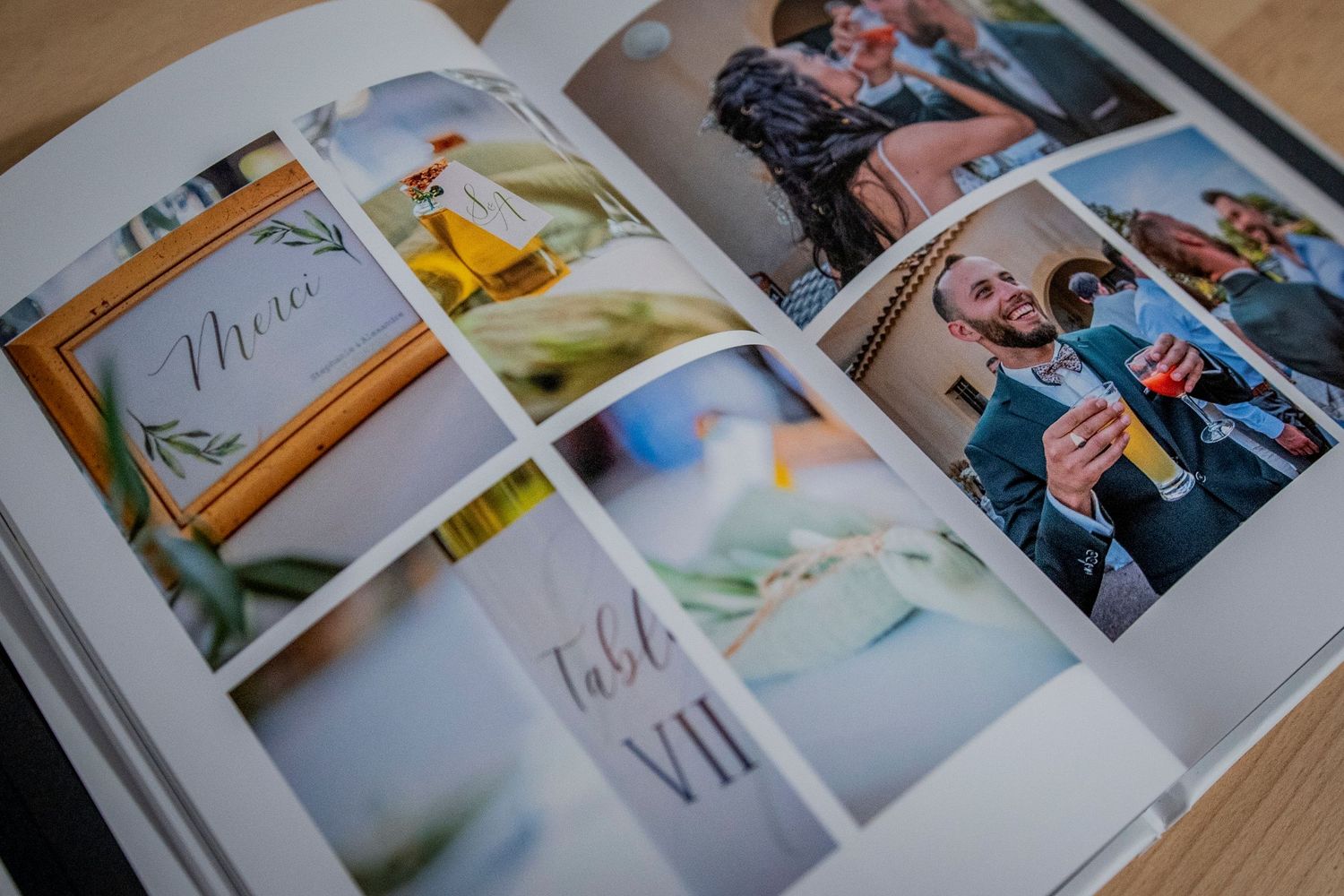 Open photo album with wedding photographs spread across multiple pages showing intimate moments and memories.