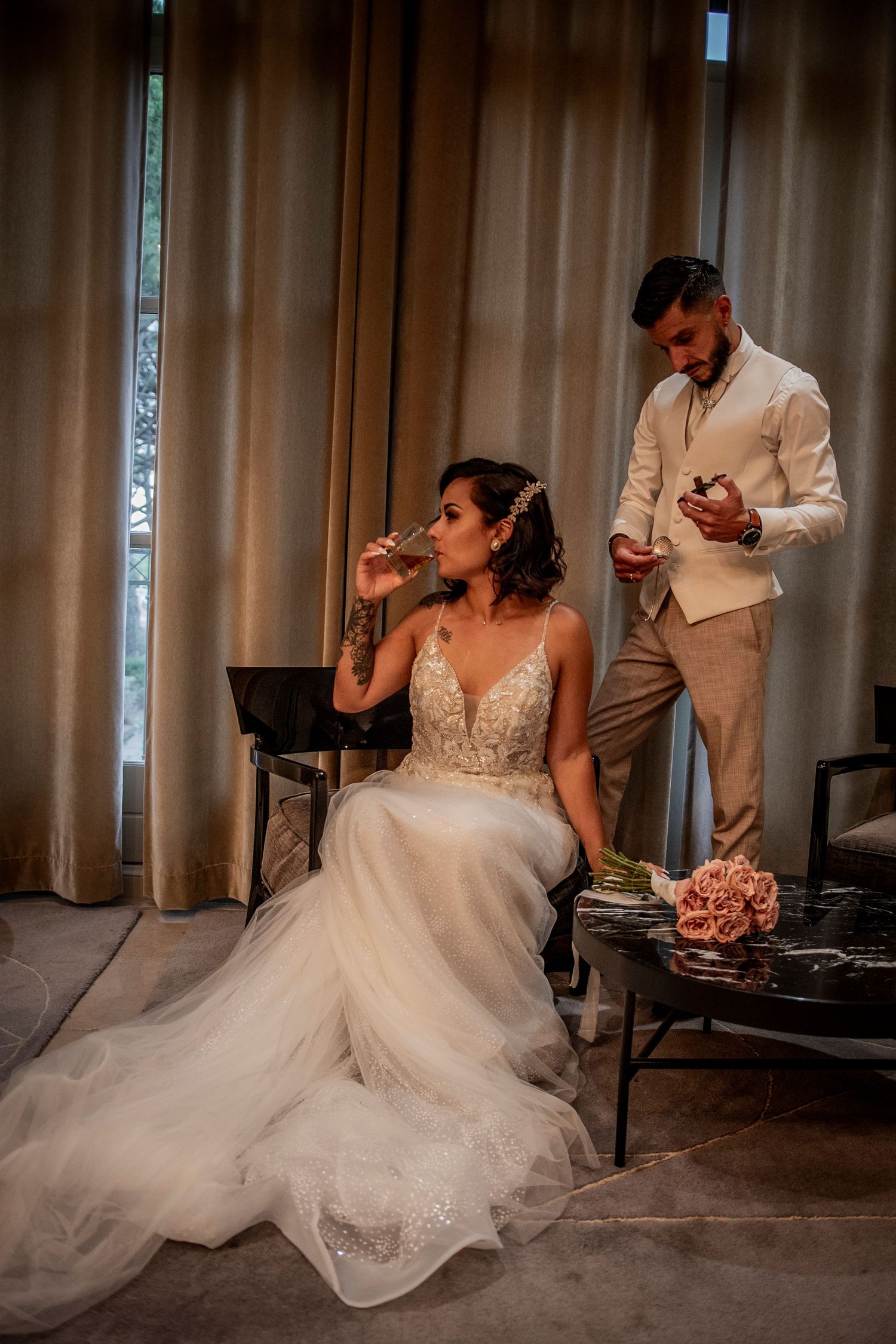 Wedding scene in a room with flowing white dress and romantic lighting.