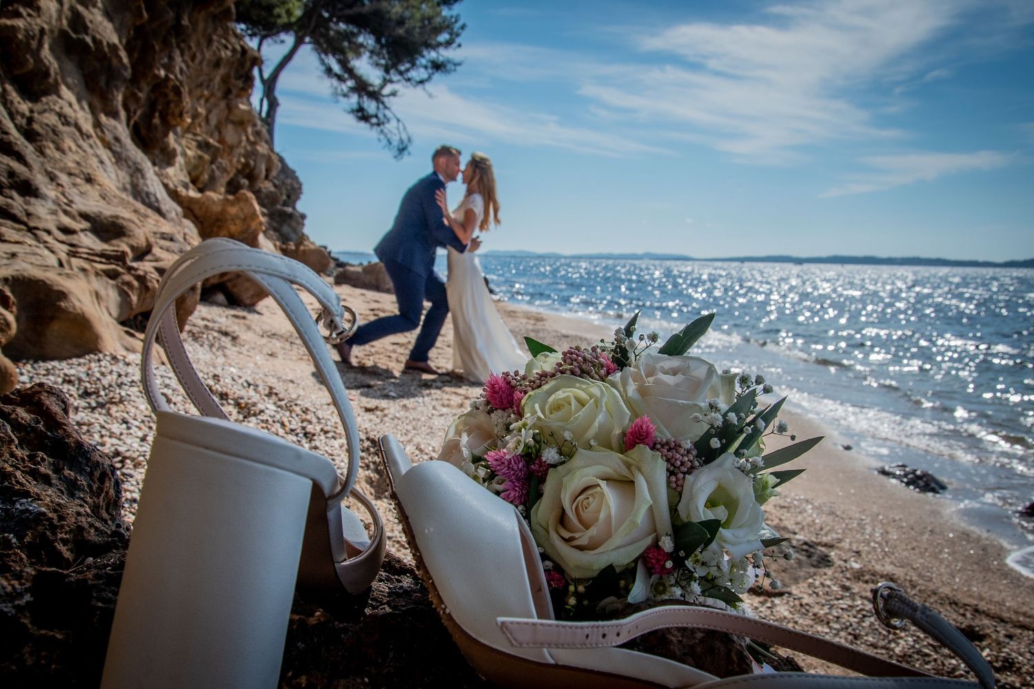 Wedding details showing floral arrangements, beach views, and decorative elements on a sunny day.