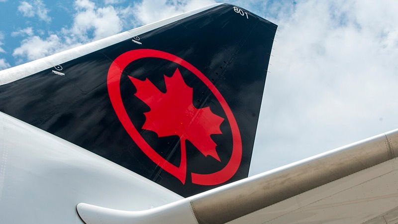 Red Star Wars Imperial logos painted on black angled surfaces against a bright blue sky with white clouds.