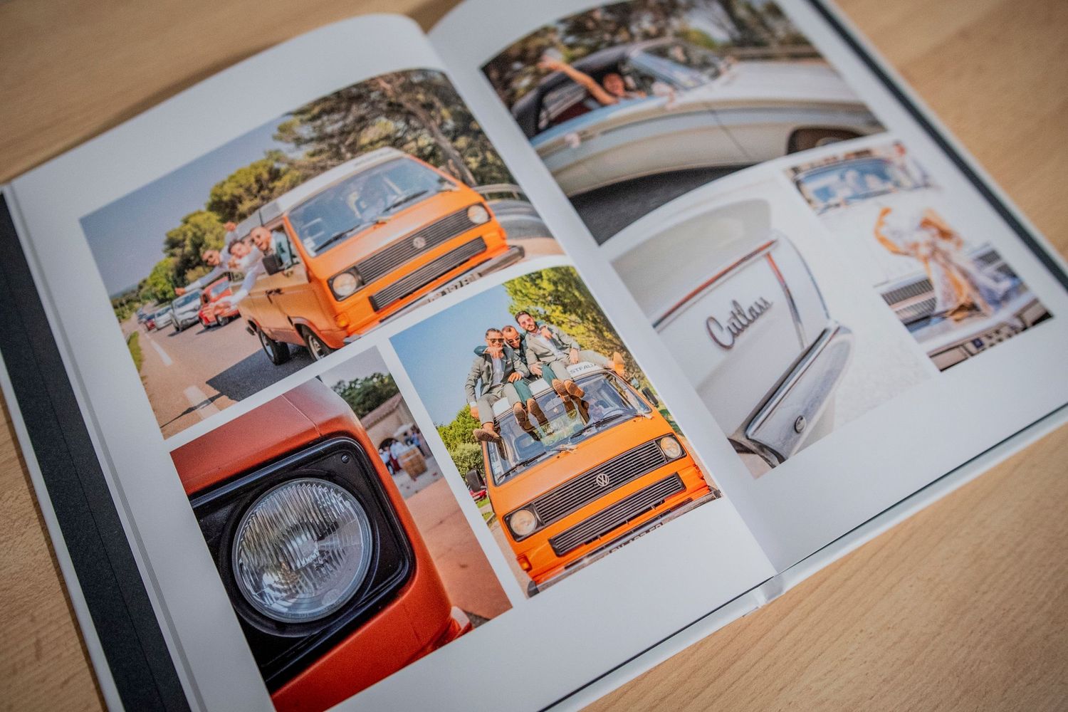 Photo book or magazine spread showing multiple detailed images of vintage orange cars and automobiles on wooden surface.