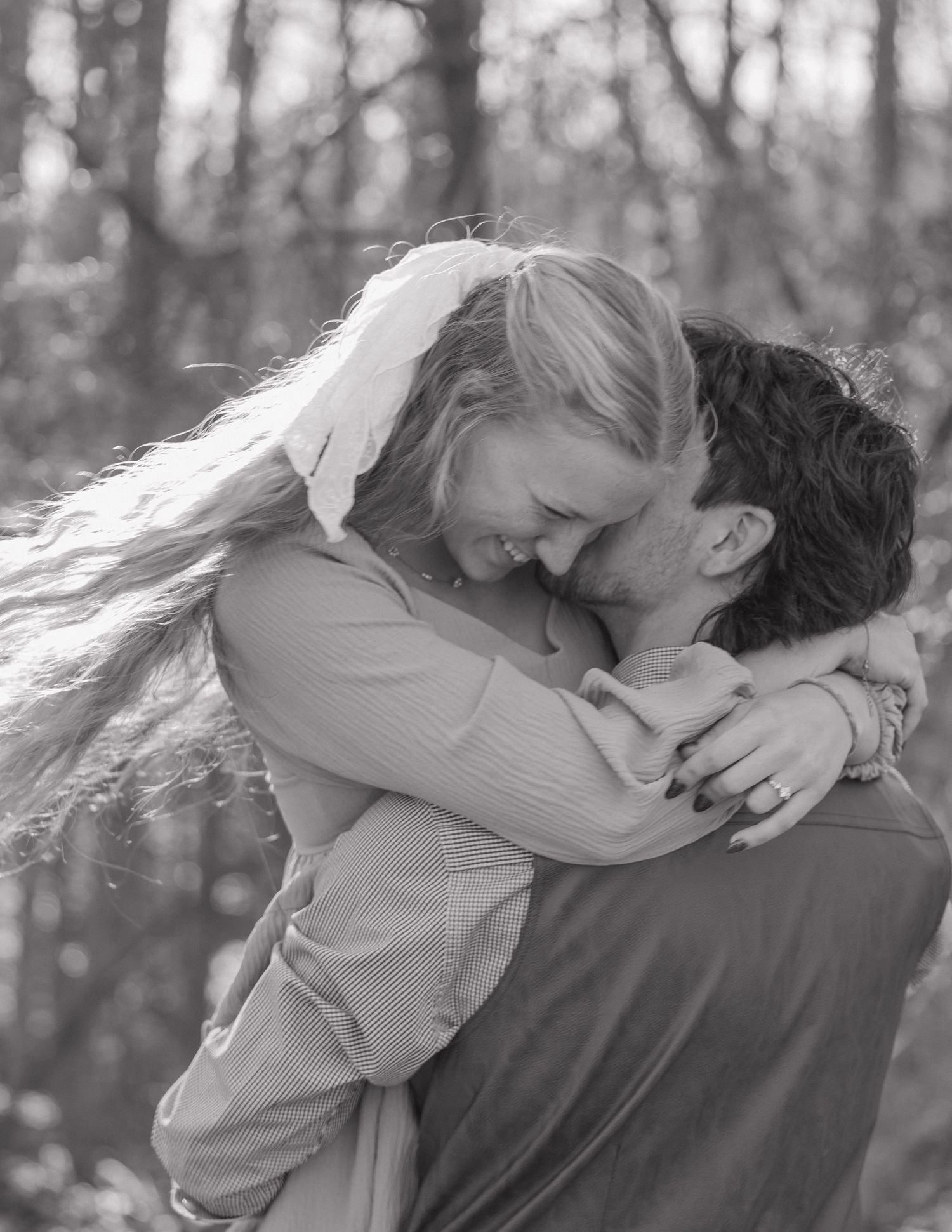 Couple walking and laughing during engagement session in Fuquay-Varina, NC by Julia Danielle Photography