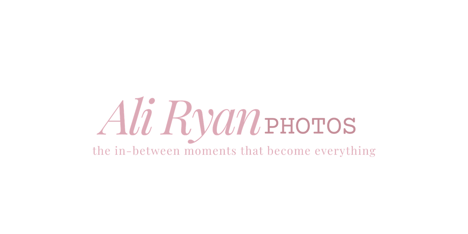 Simple photography brand logo in soft pink with clean typography and tagline.