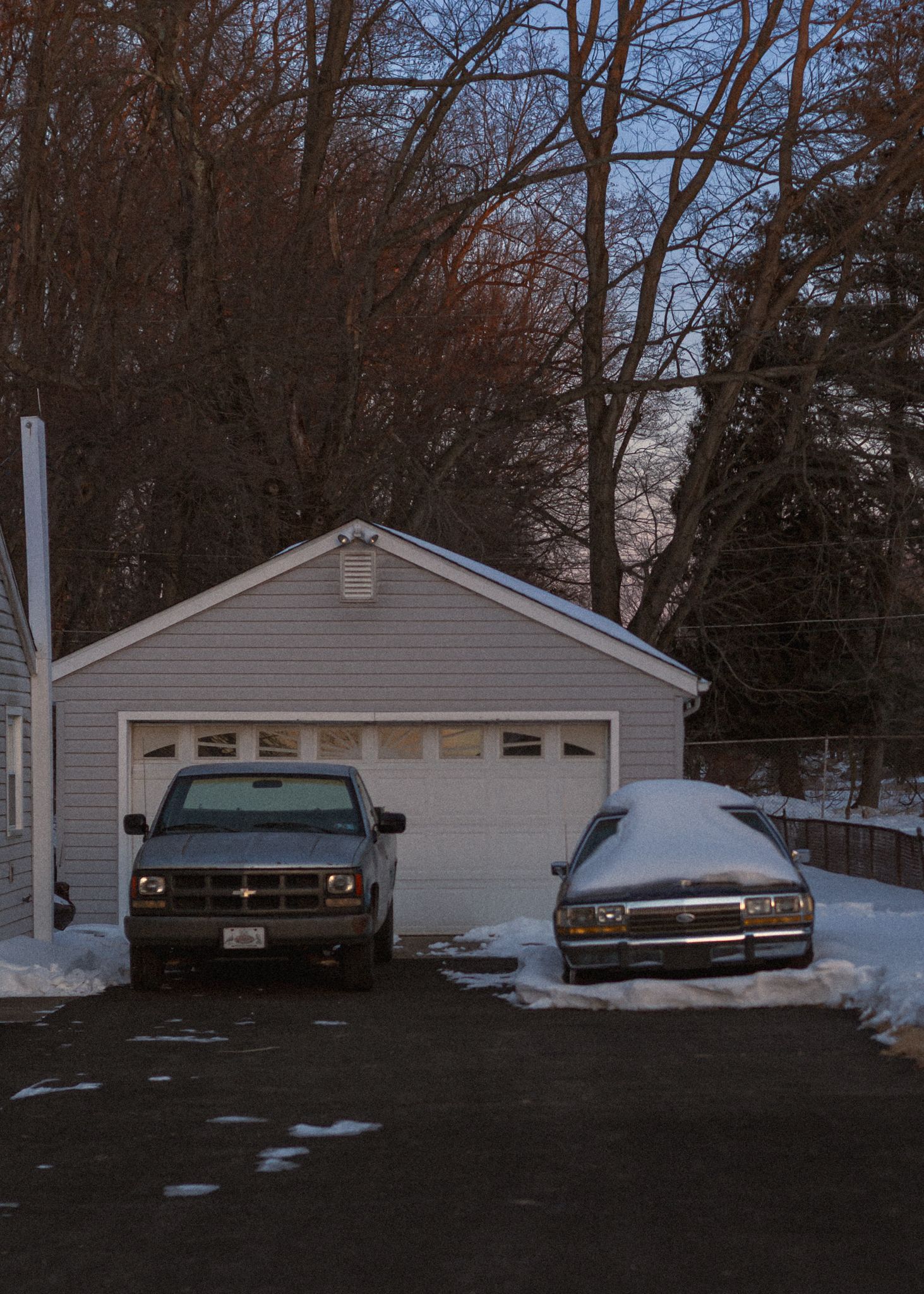 A series of three photos showing a beige garage with snow on the ground and bare winter trees in the background.
