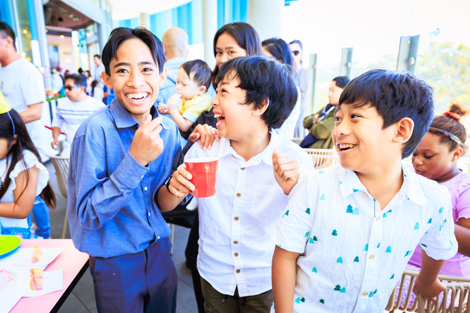 A festive celebration scene with blue decorations and party atmosphere.