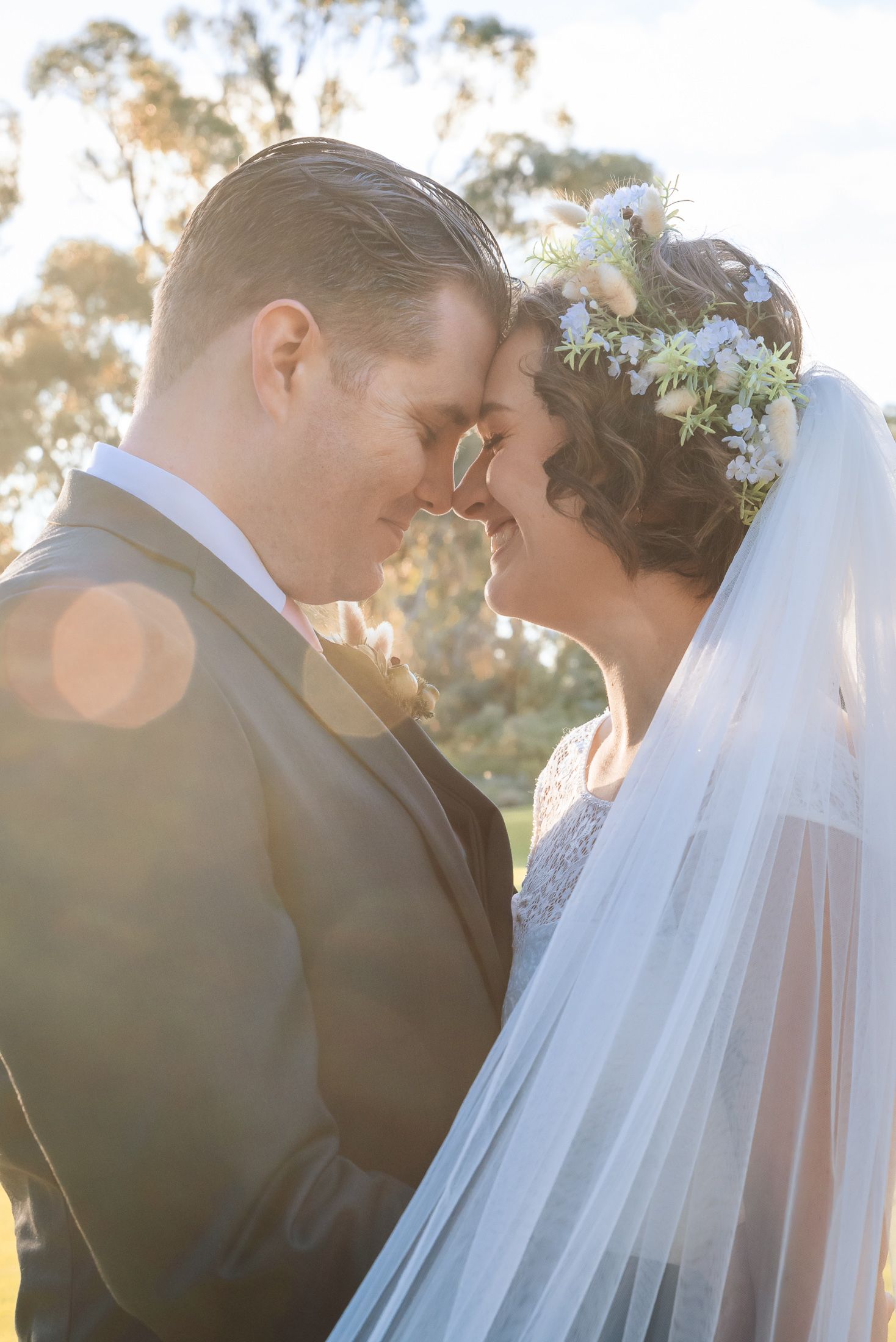 Romantic wedding photo series showing close-up views of a couple sharing tender moments at sunset.