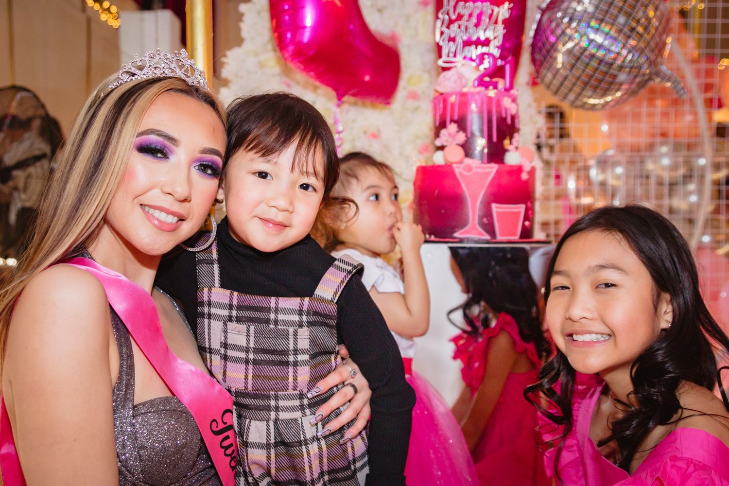 Pink-themed party celebration with festive decorations and sparkly accents.