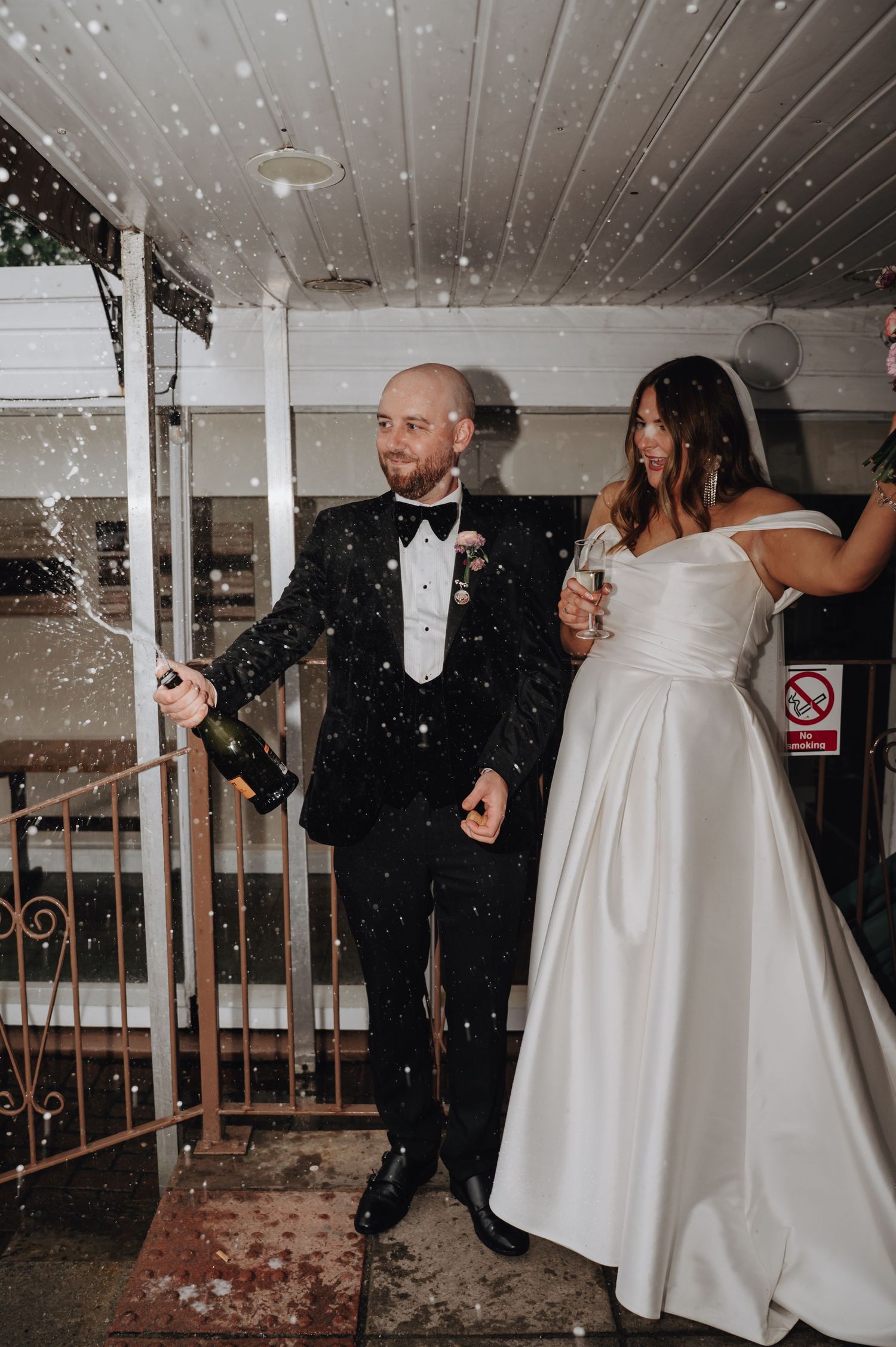 A dance sequence shows a couple in wedding attire spinning together with bubbles floating through the air.