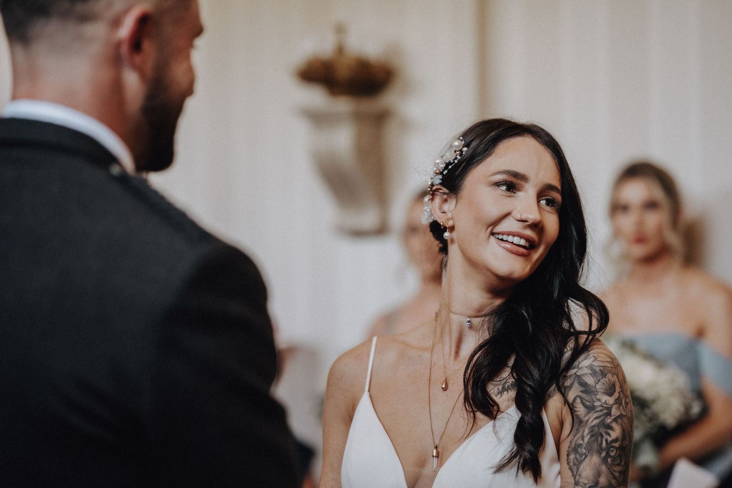 A candid emotional moment between the bride and groom during their wedding ceremony.