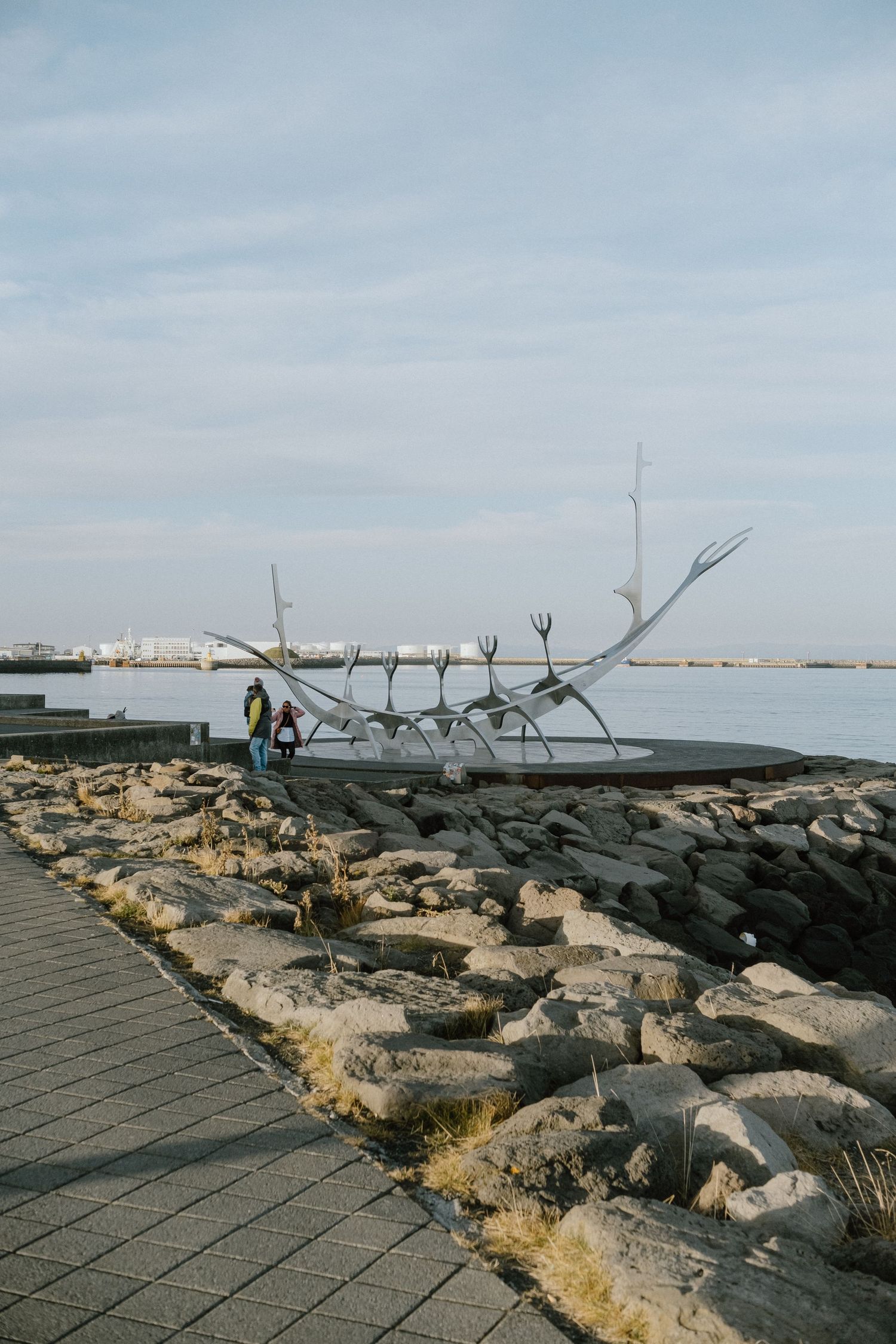 Sun Voyager steel sculpture installation sits along Reykjavik's waterfront against a bright sky.