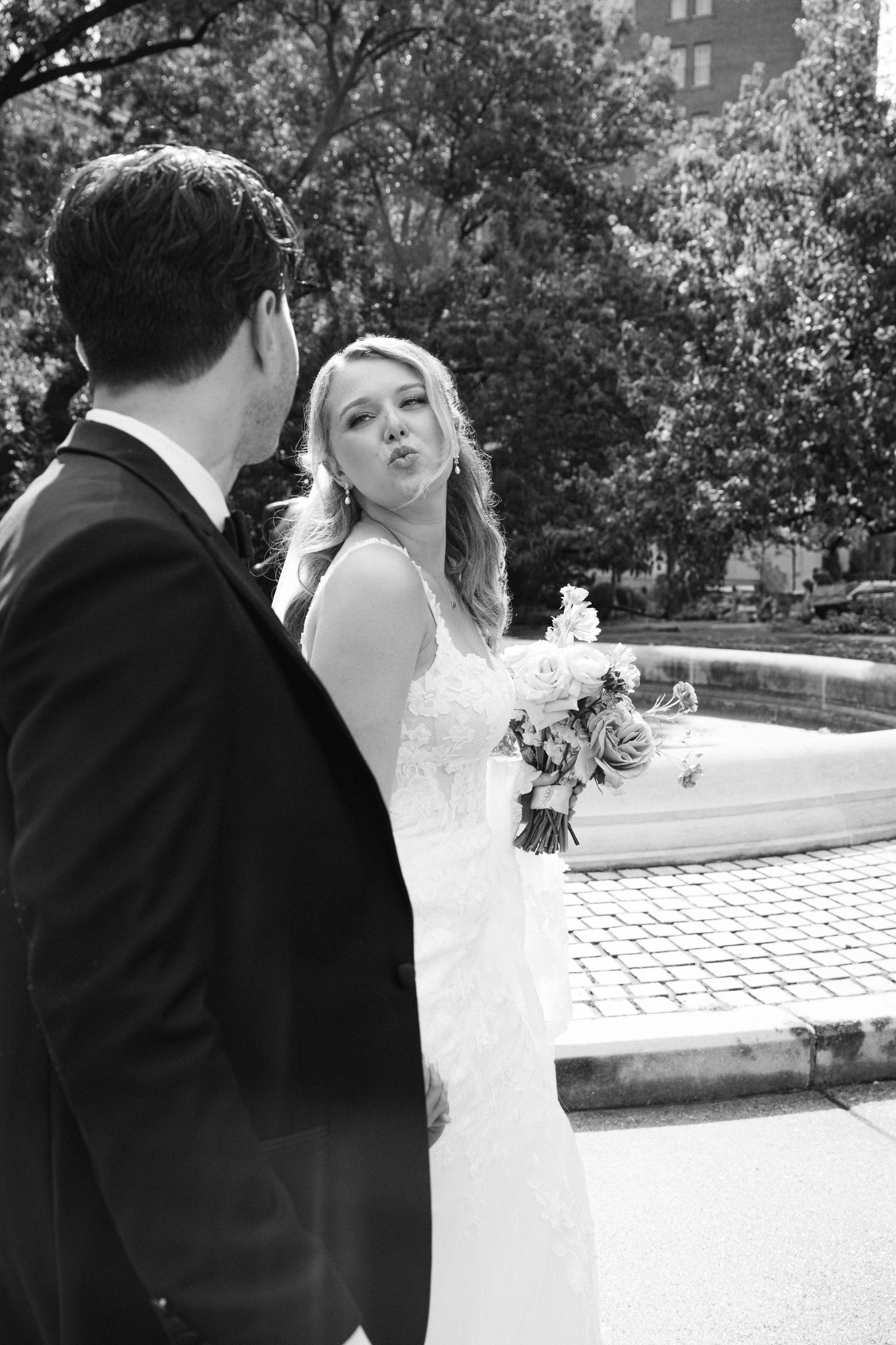 Black and white photos of a couple sharing romantic moments during their wedding photoshoot.