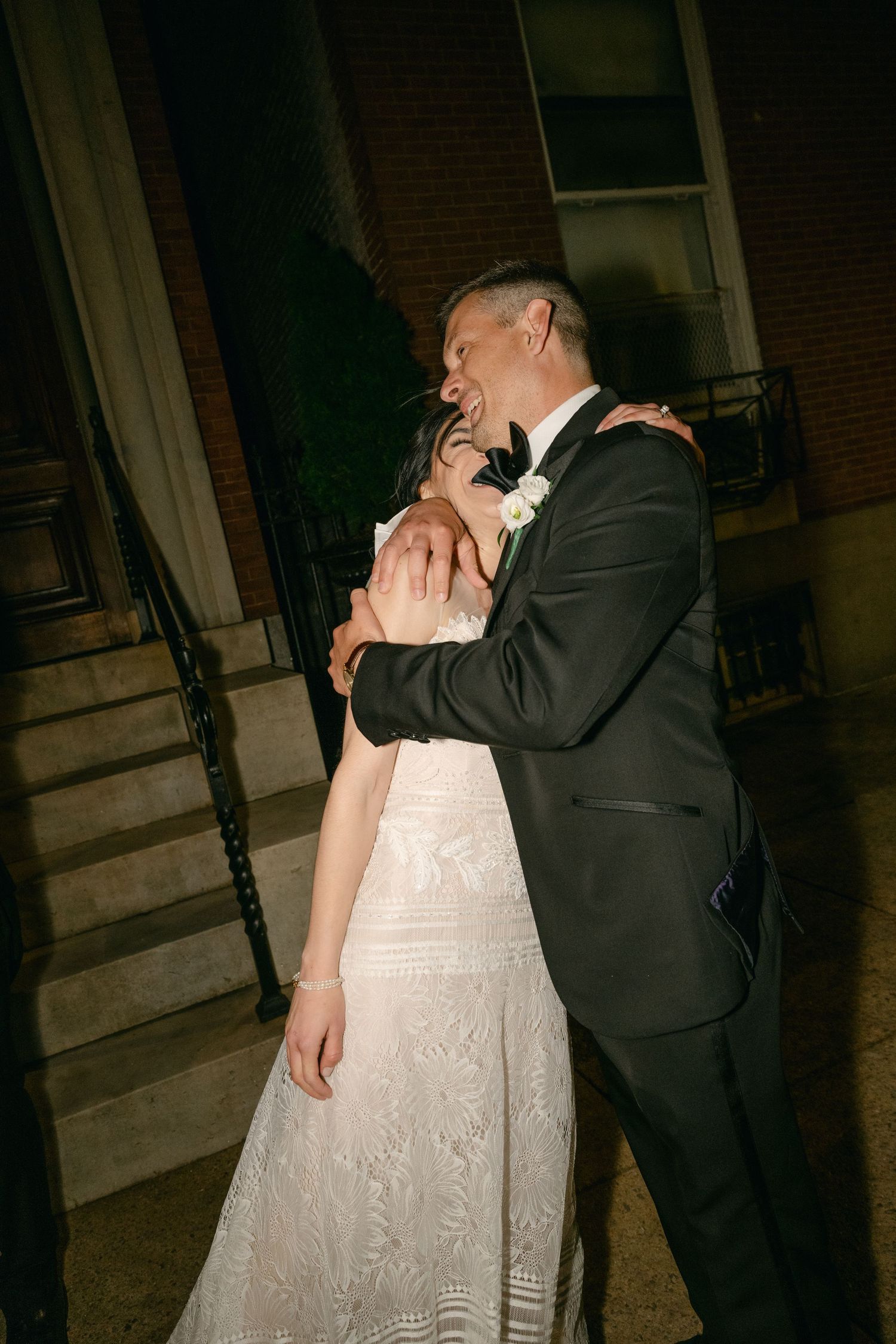A romantic moment between newlyweds sharing an intimate dance in the evening.