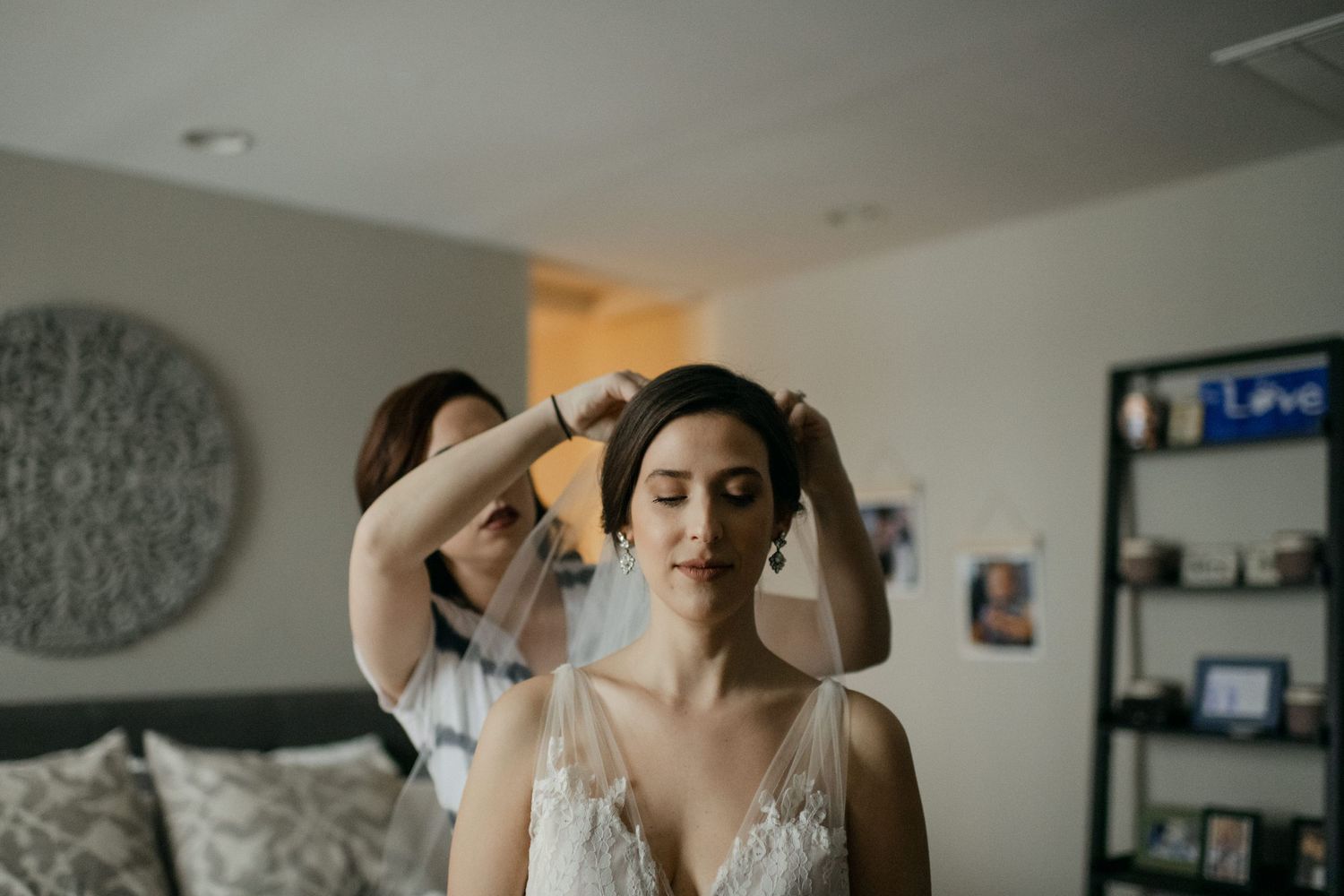 Wedding preparation scene with lace dress and getting ready details.