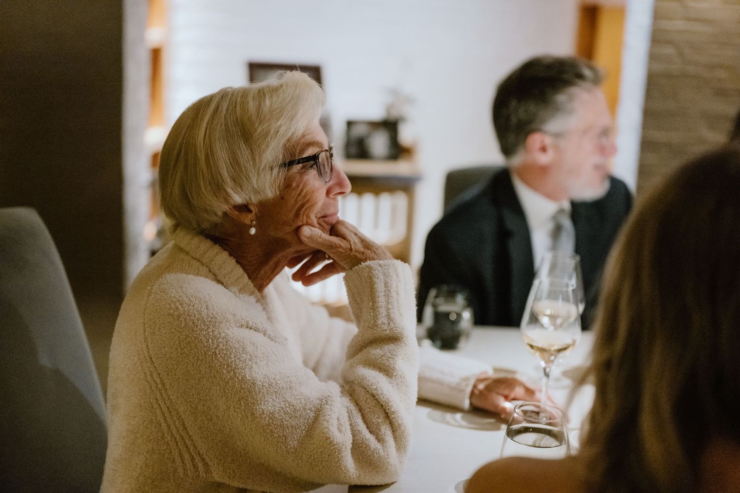 An emotional moment captured during wedding reception toasts and speeches.