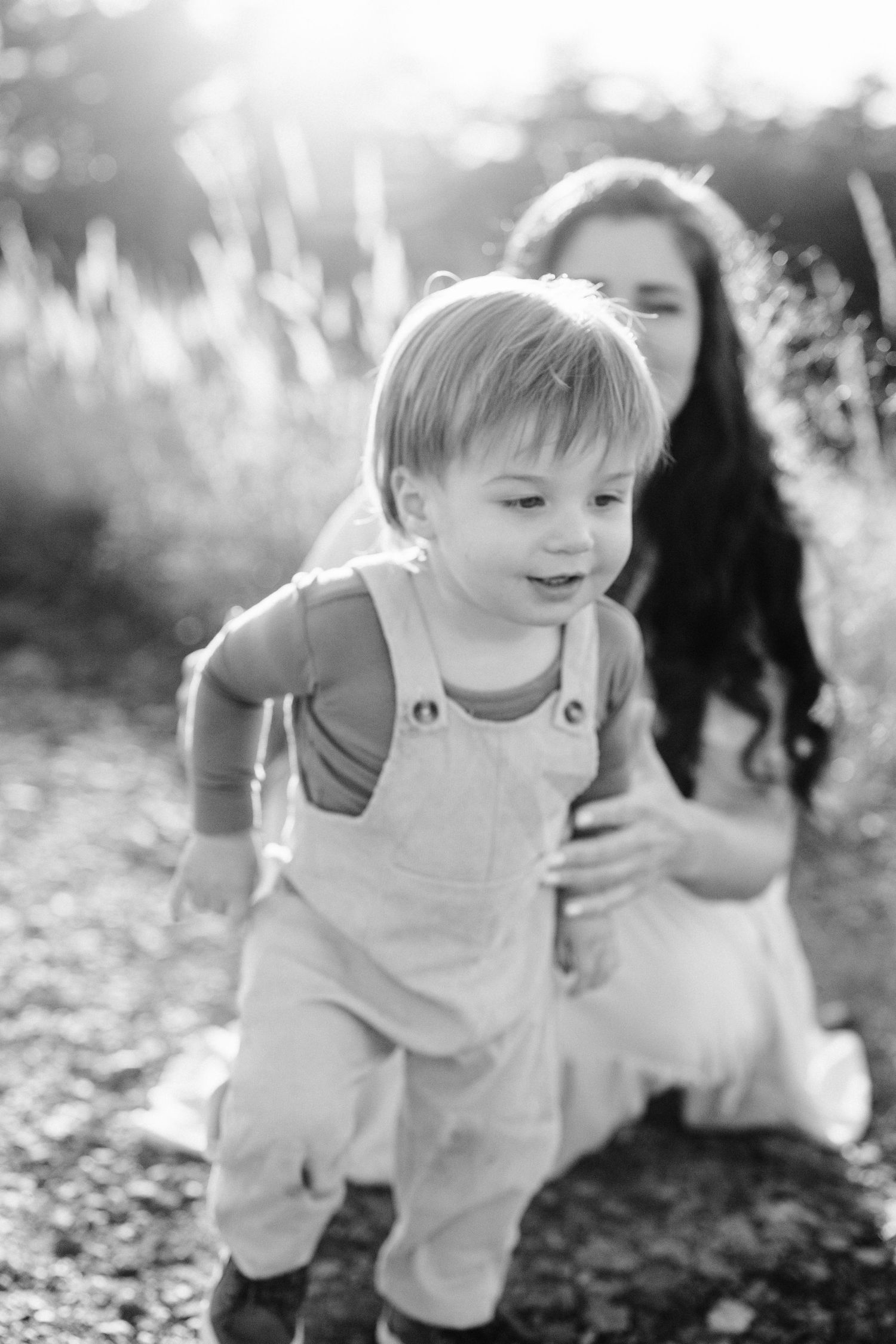 A black and white candid moment captured on a nature trail.