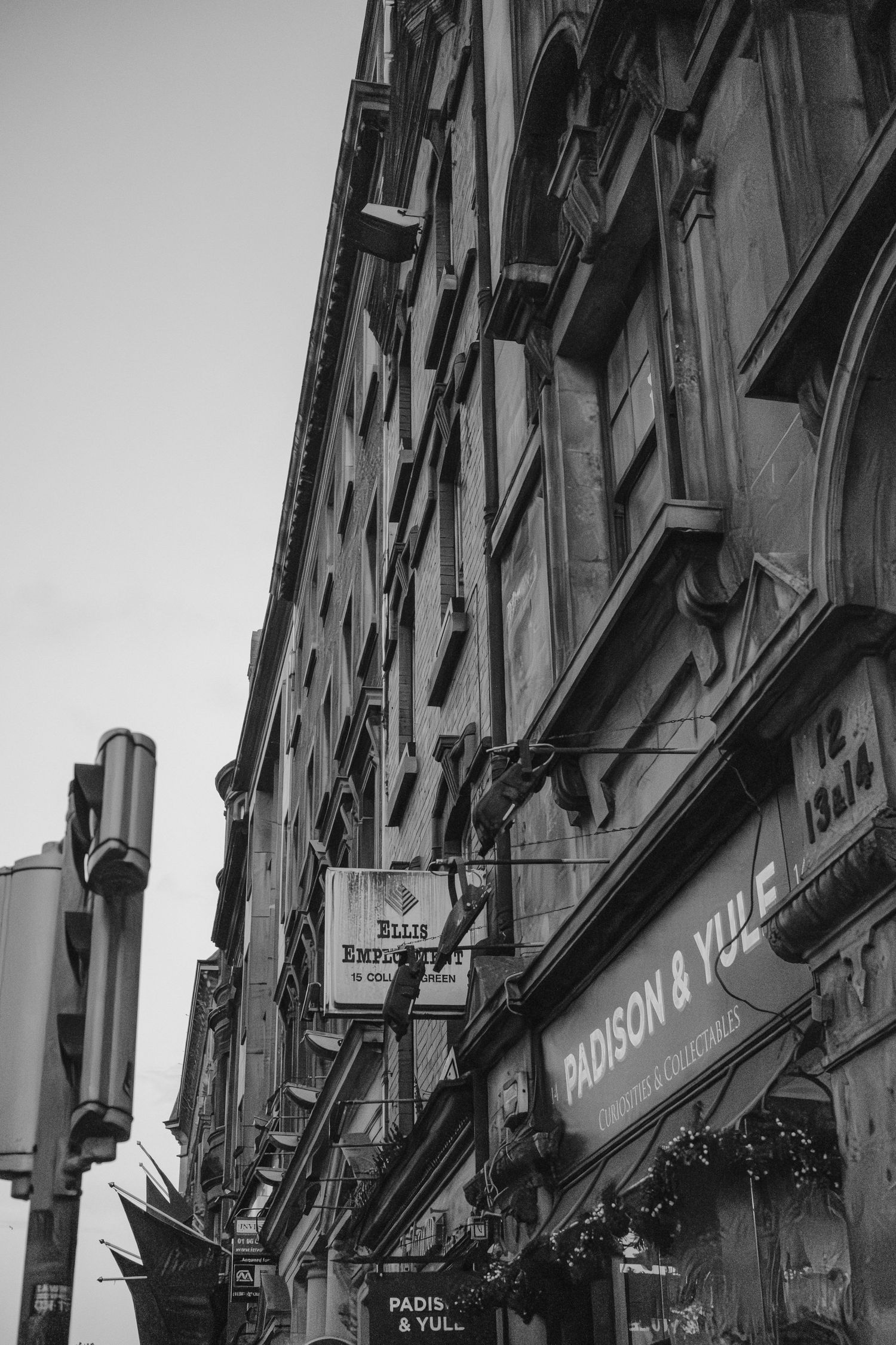 Black and white architectural view of a historic European building facade with ornate details.