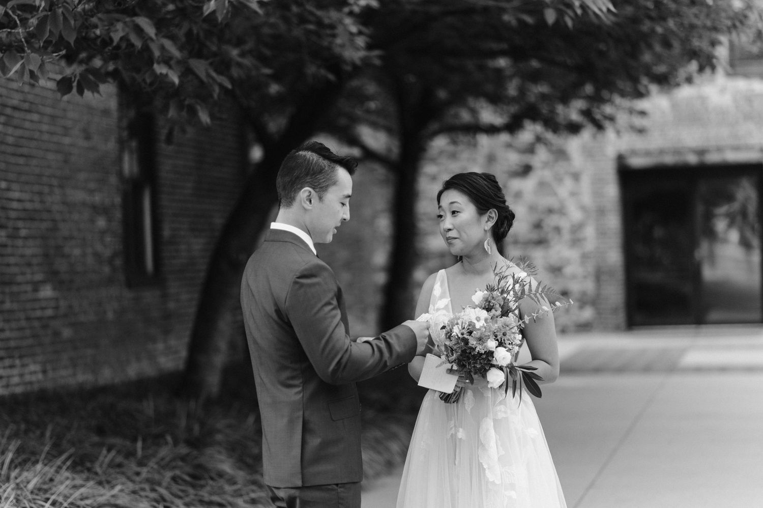 groom reads bride vows before elopement