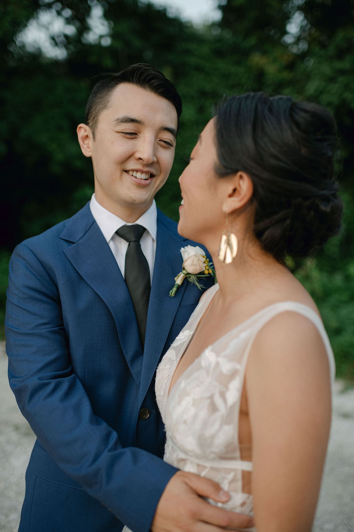 groom smiles at bride