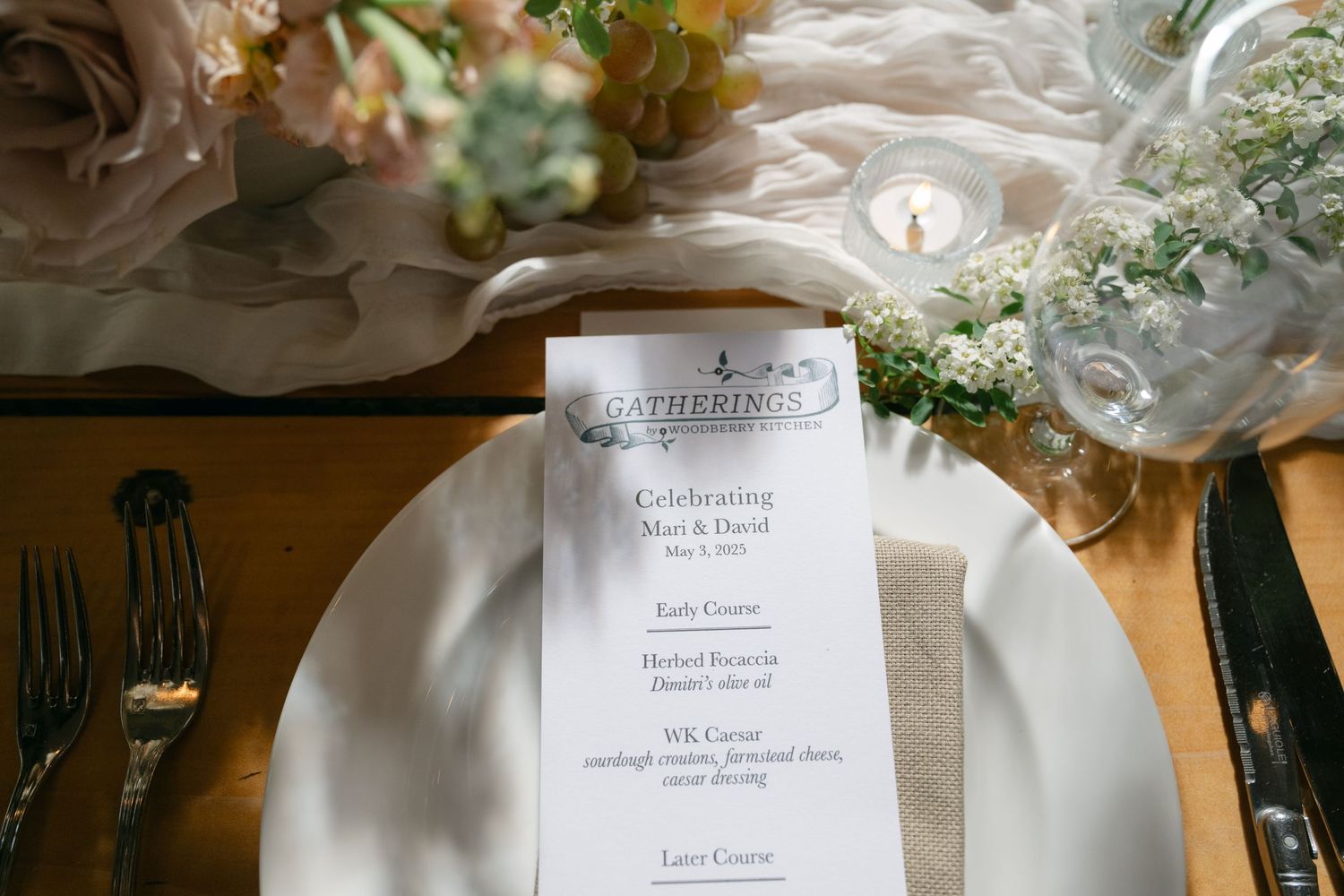 Elegant wedding reception table settings with white linens and floral centerpieces.