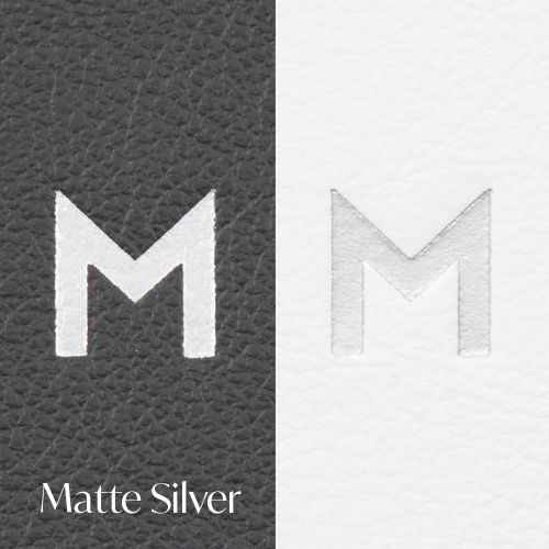 A series of metallic letter M designs showing a progression from dark textured to matte silver finish.