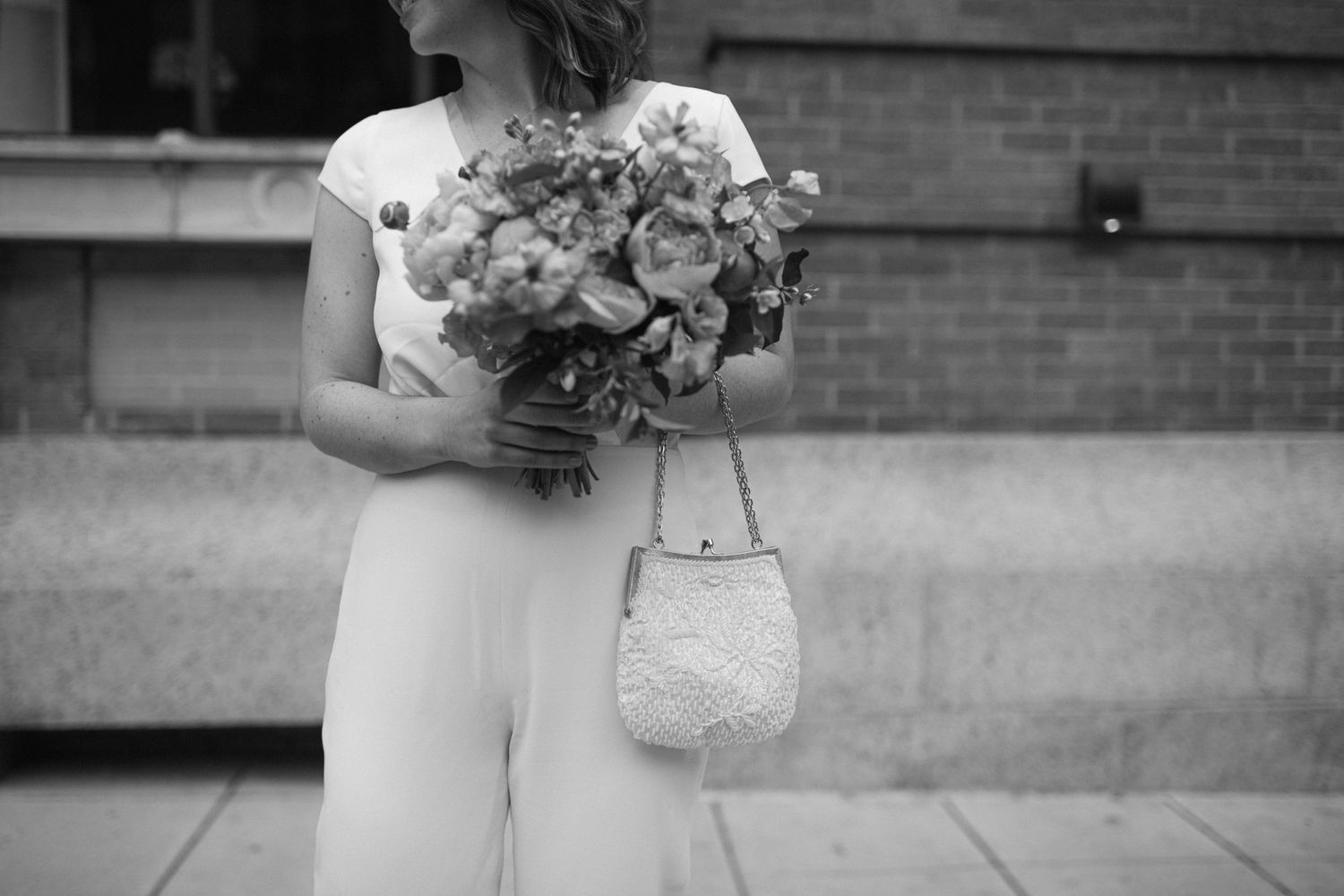 close up of brides beaded clutch