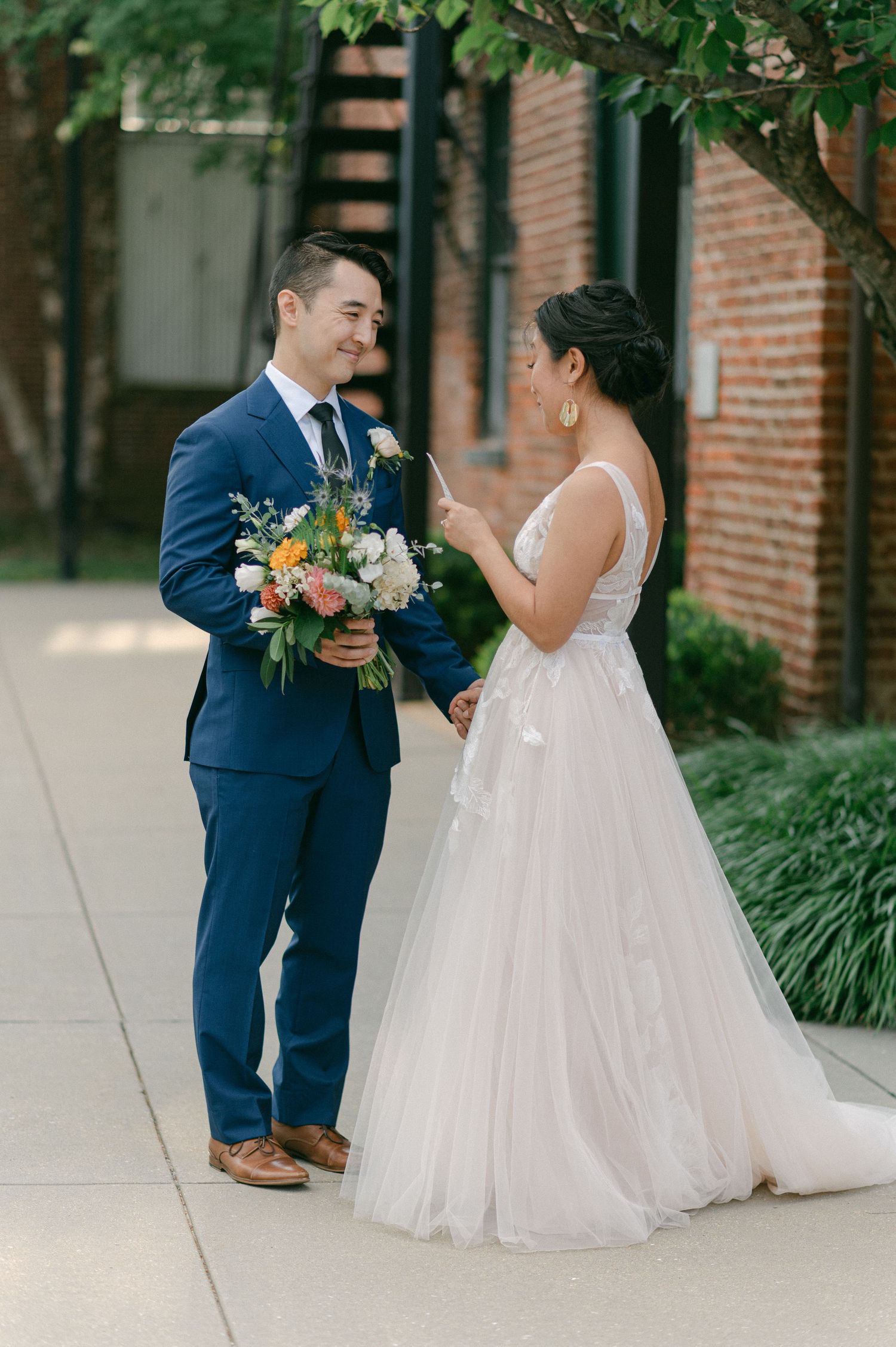 bride reads vows to groom before their elopement