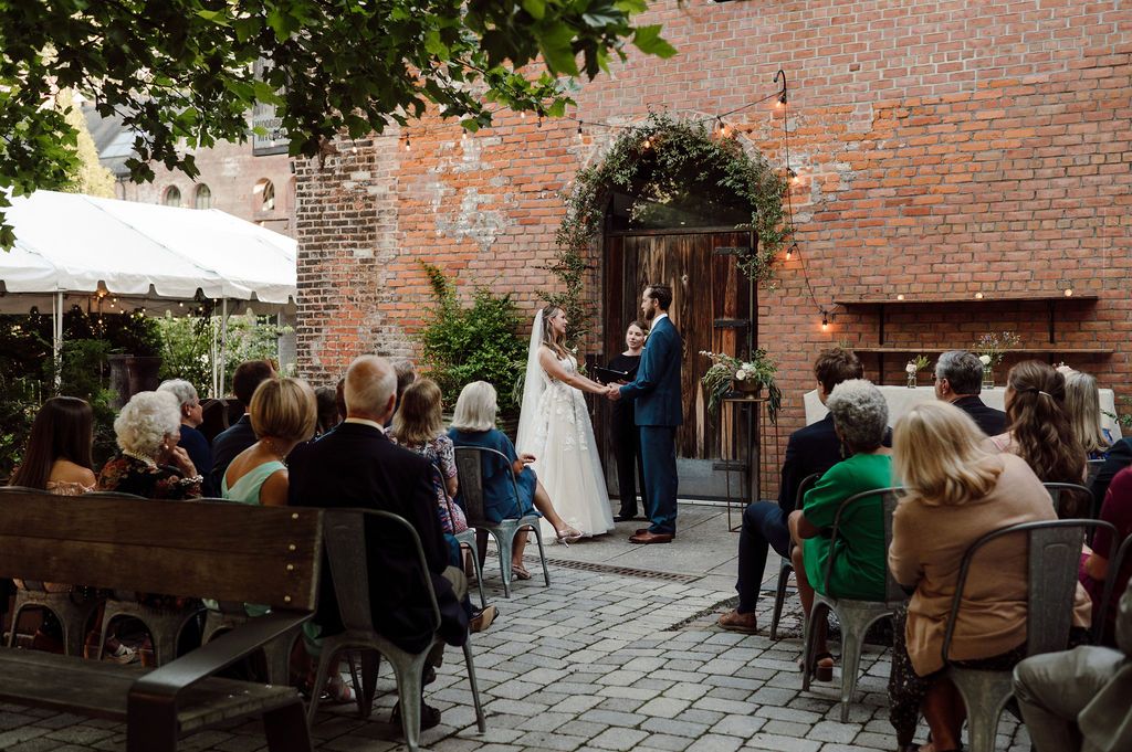 outdoor intimate wedding ceremony at woodberry kitchen by maryland wedding photographer