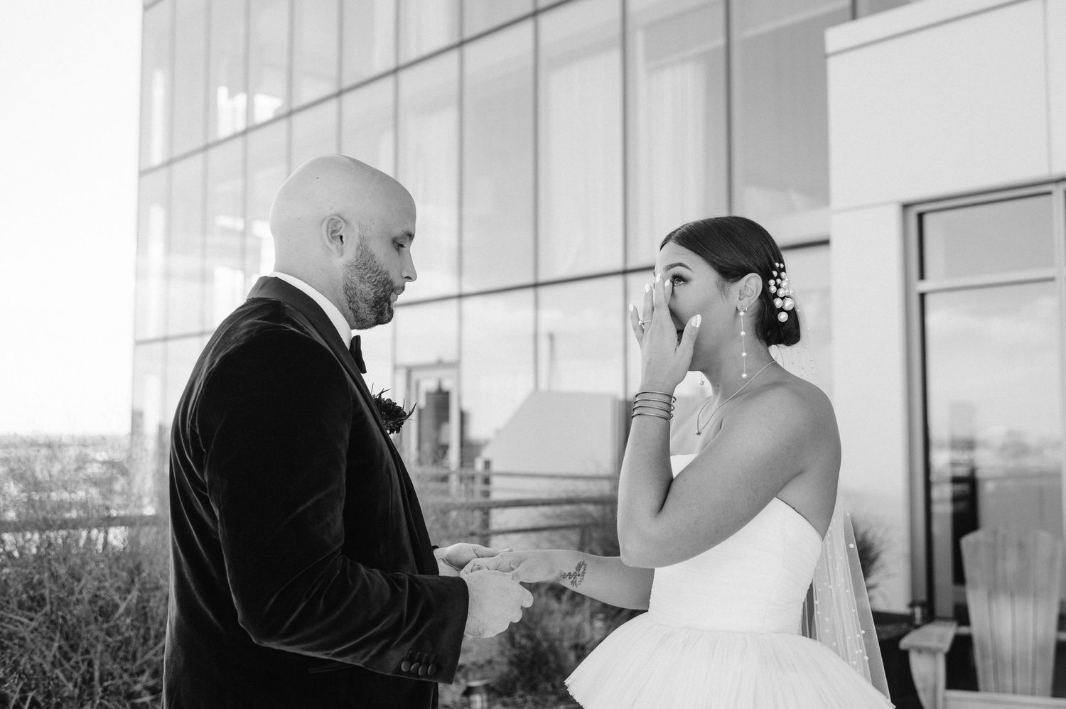 An emotional black and white moment between a couple during their first look.