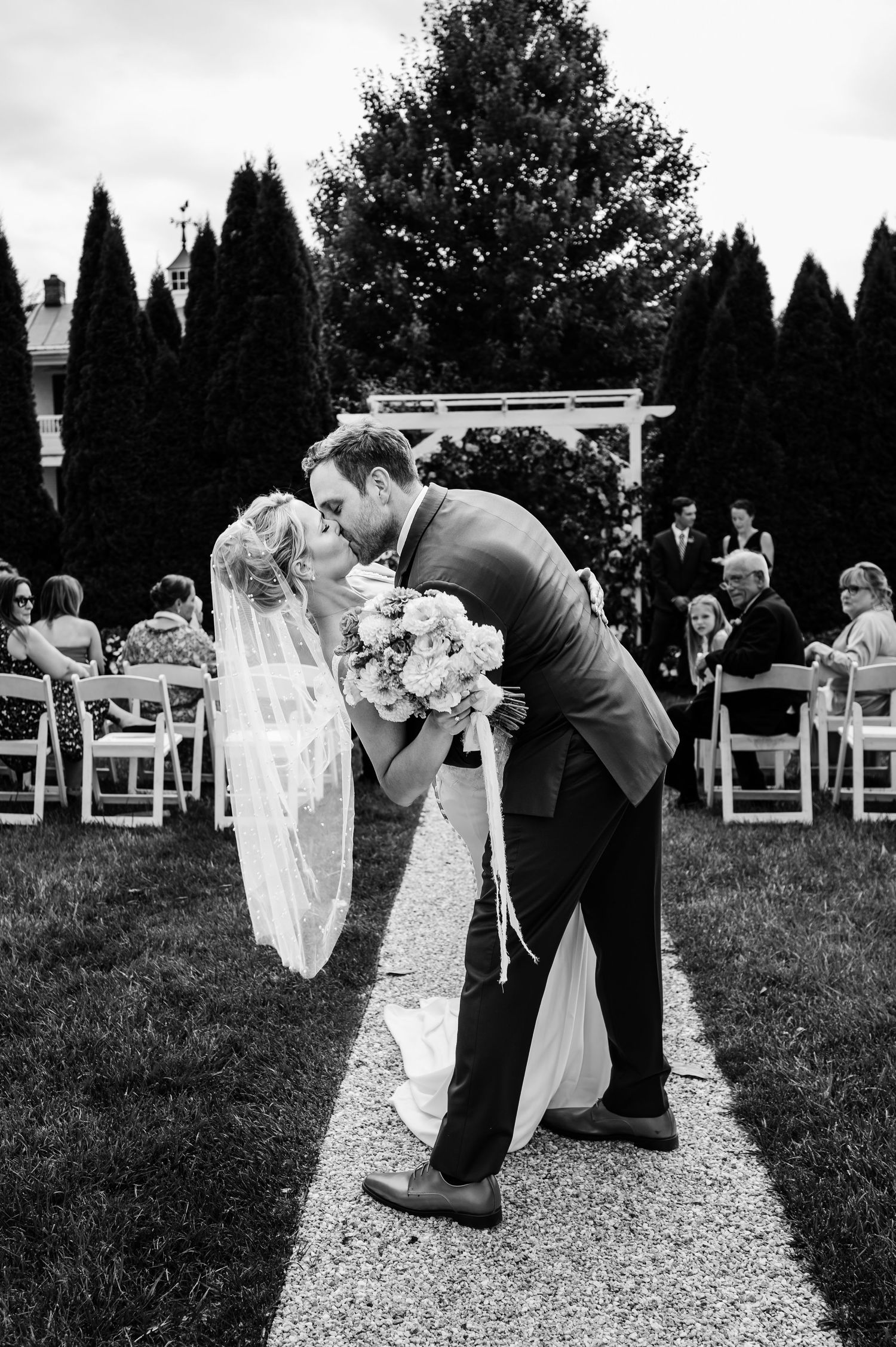 bride and groom kissing at wedding ceremony antrim 1844 intimate elopement wedding maryland