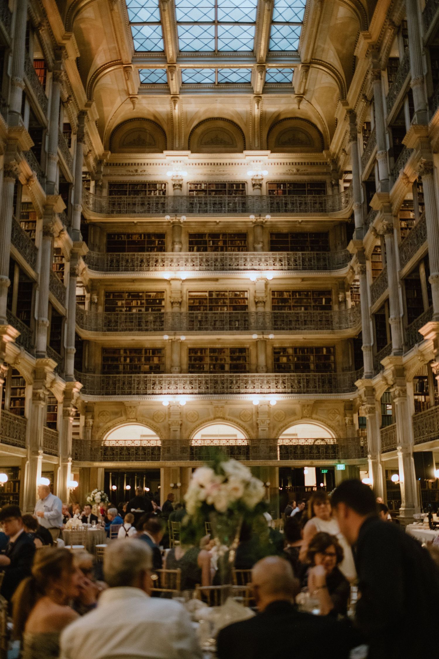 Stunning multi-level historic library venue decorated for an elegant wedding reception.