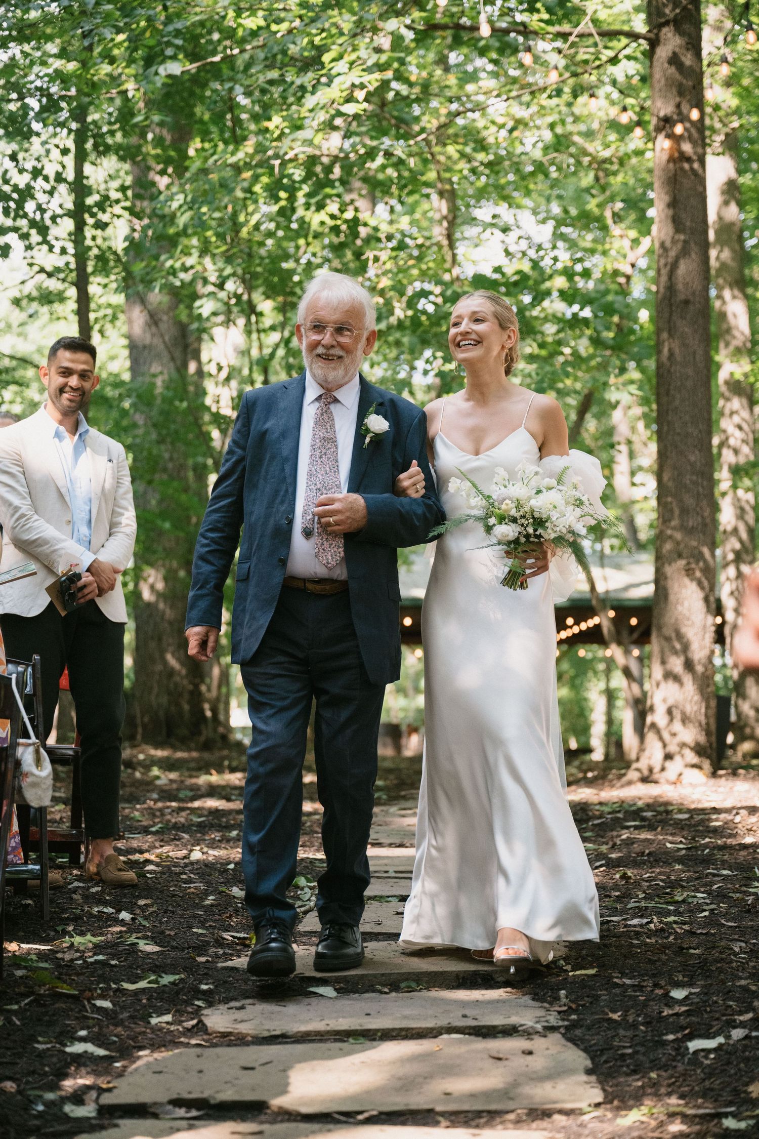 bride and father walk down the aisle